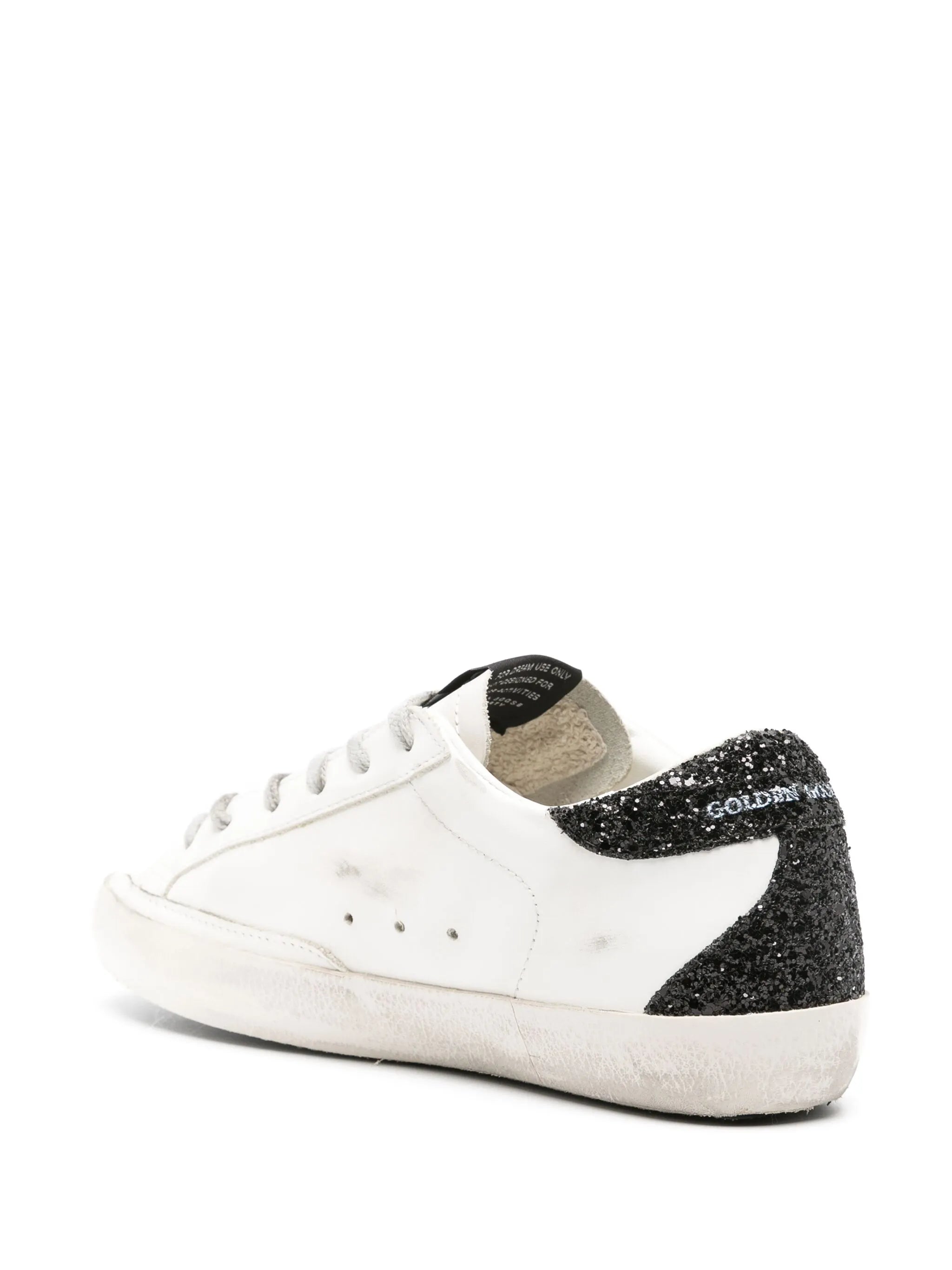 Super-Star trainers with gold star and black glitter heel tab