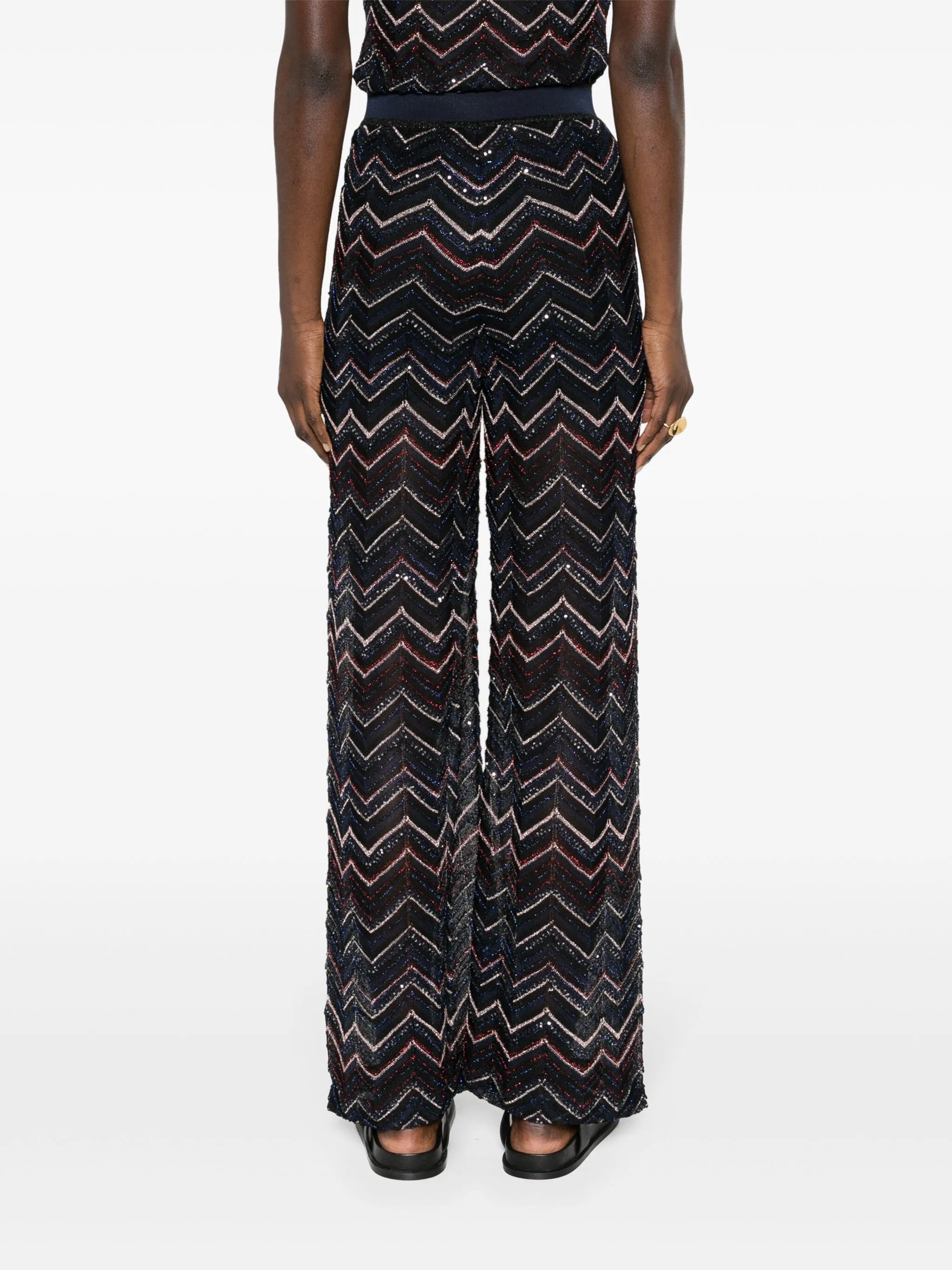 flared chevron-knit trousers