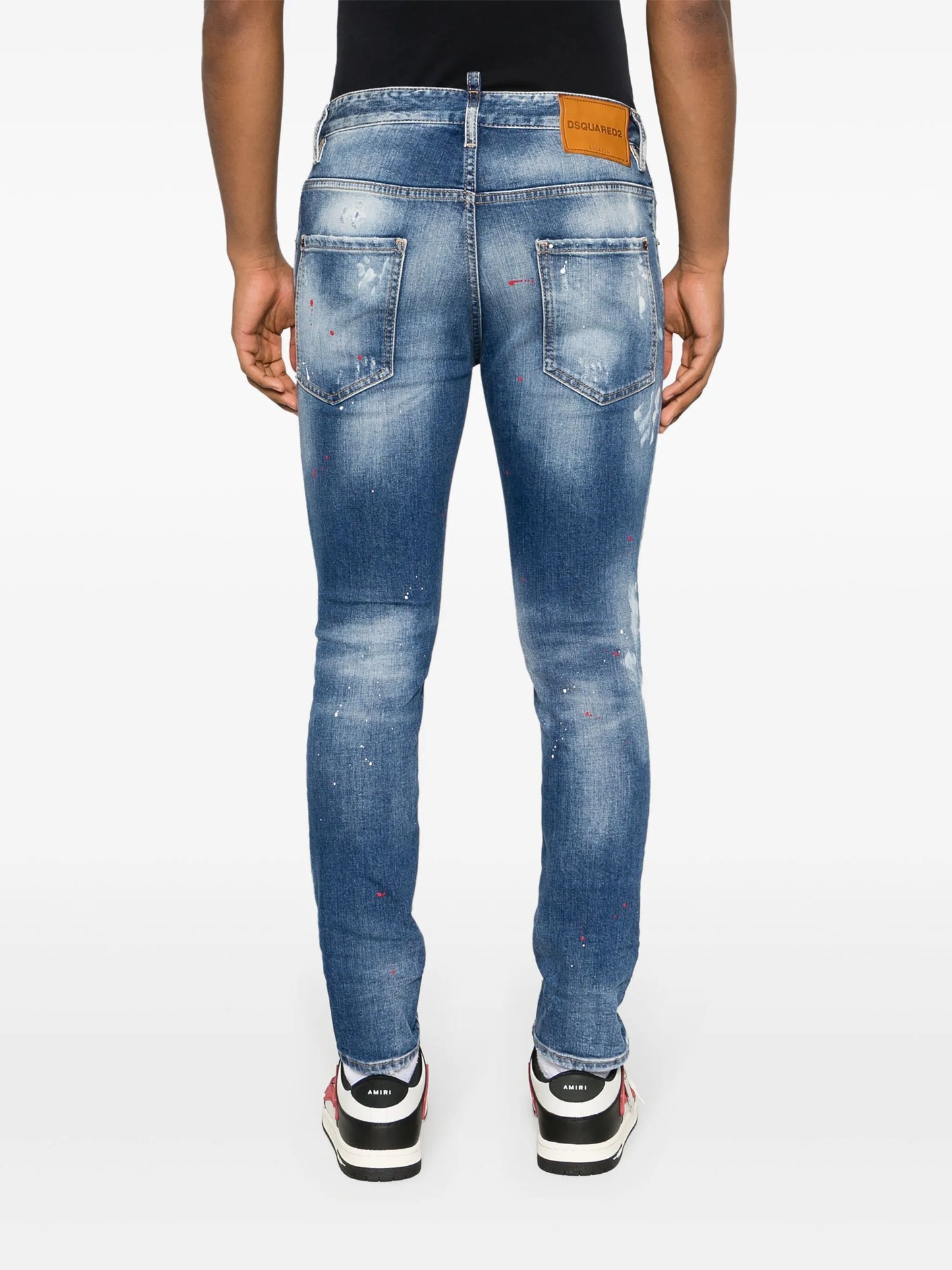 paint-splatter distressed skinny jeans