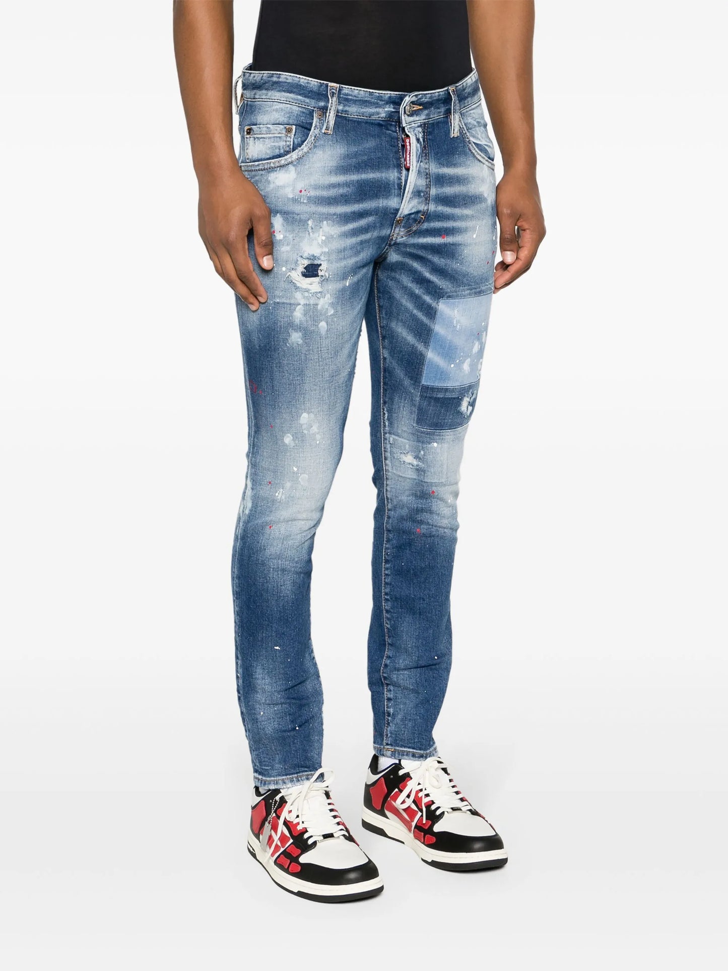 paint-splatter distressed skinny jeans