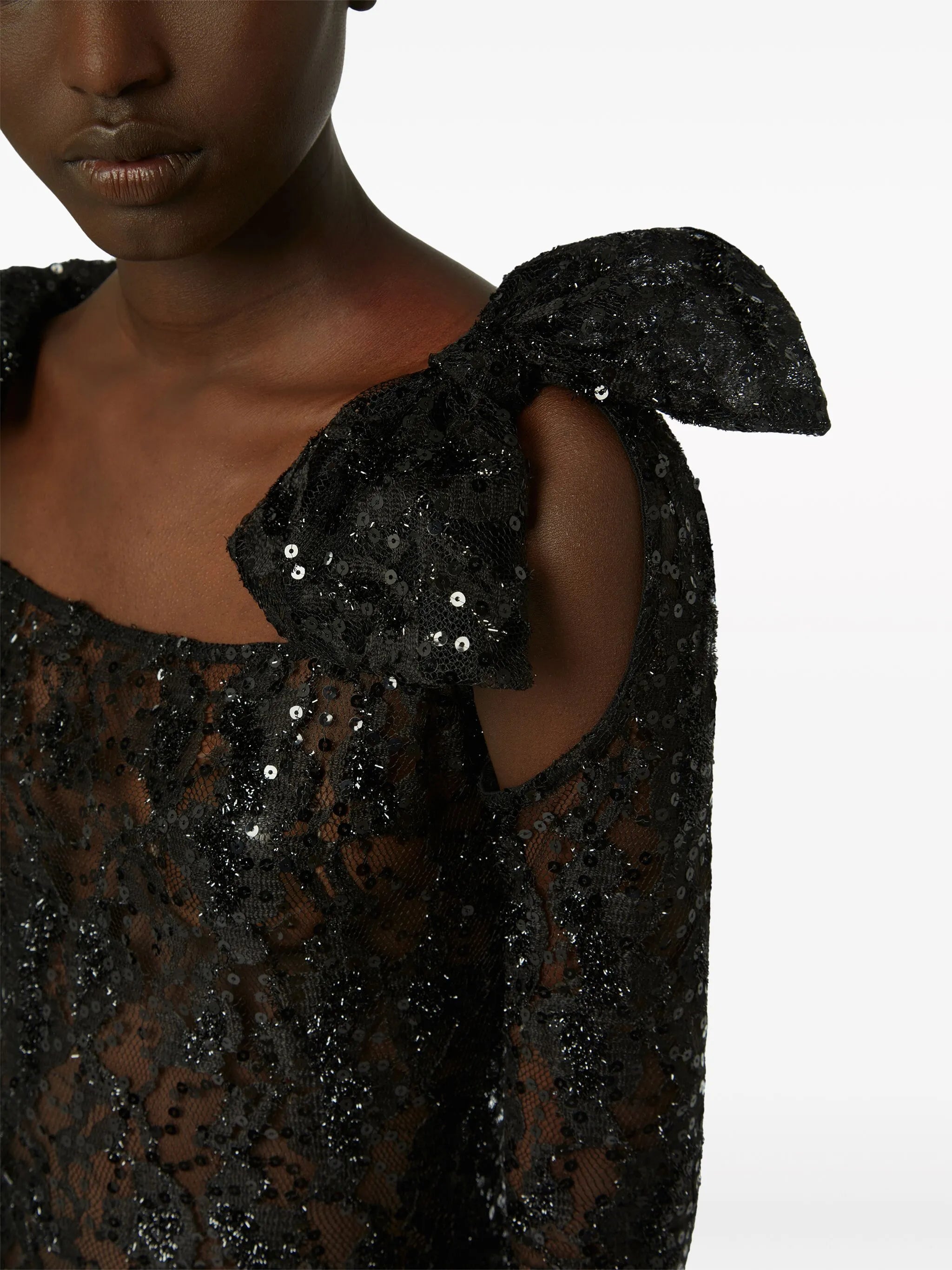 bow-embellished sequinned lace gown
