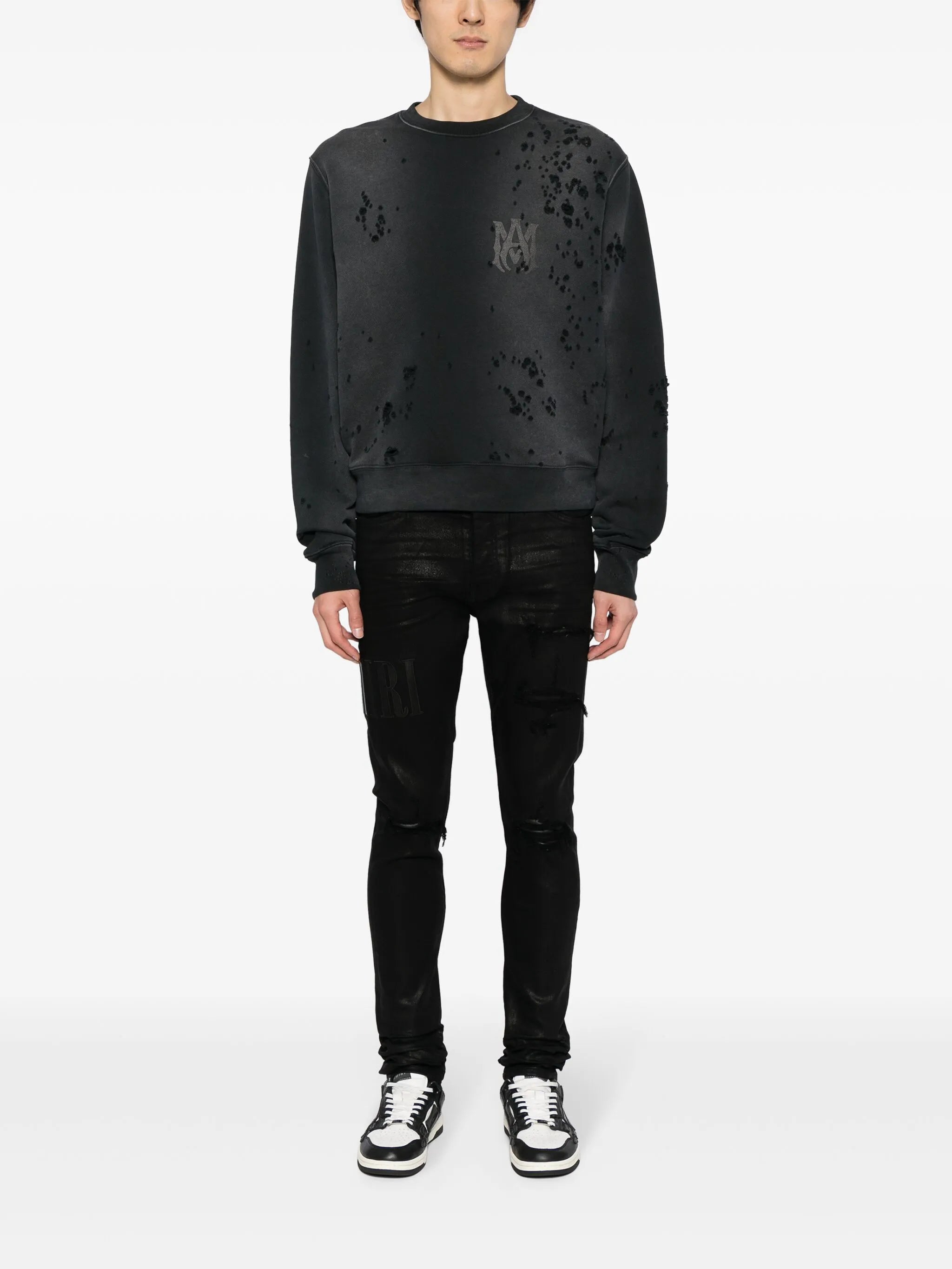 logo-embroidered distressed slim-cut jeans