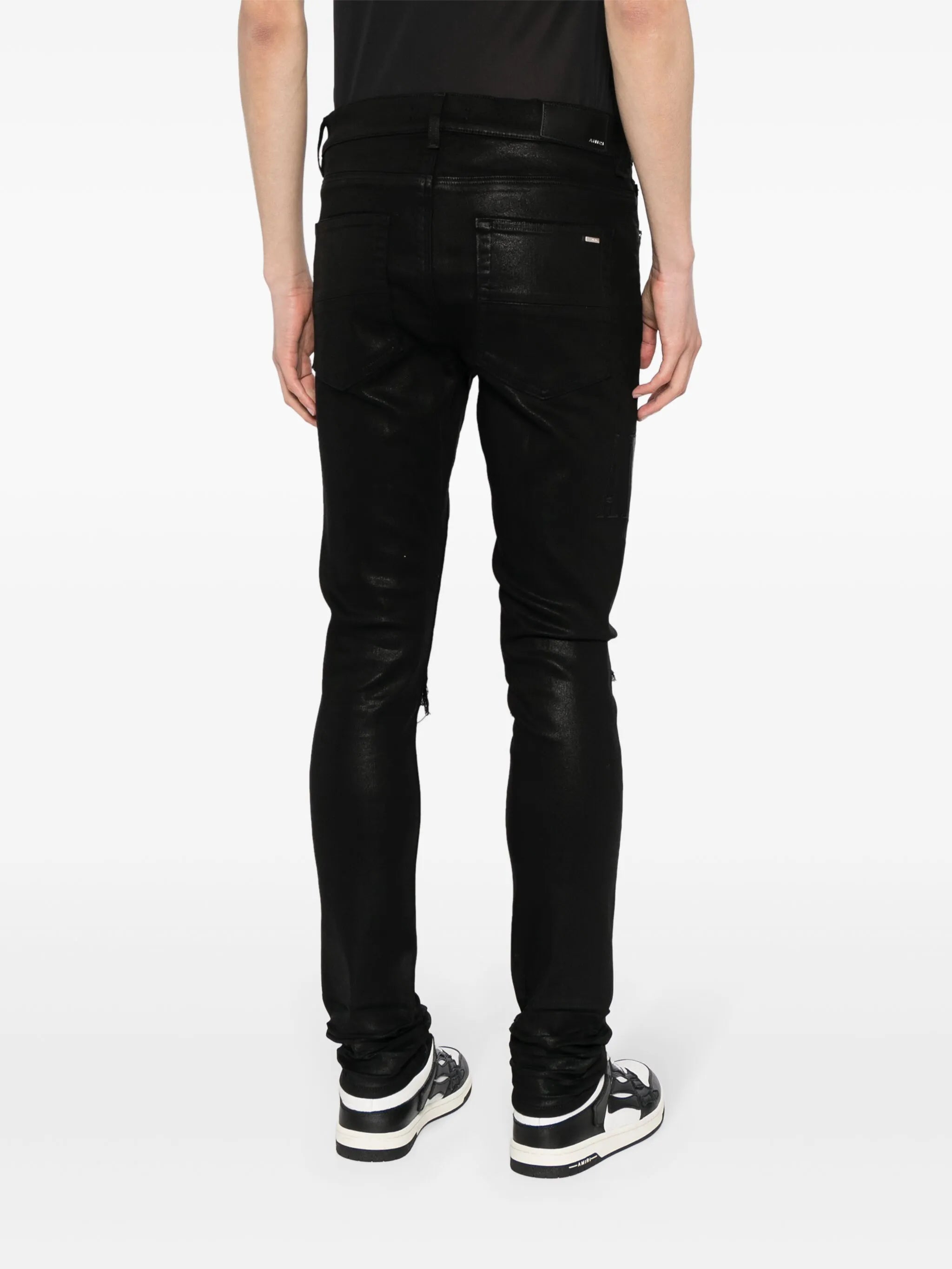 logo-embroidered distressed slim-cut jeans