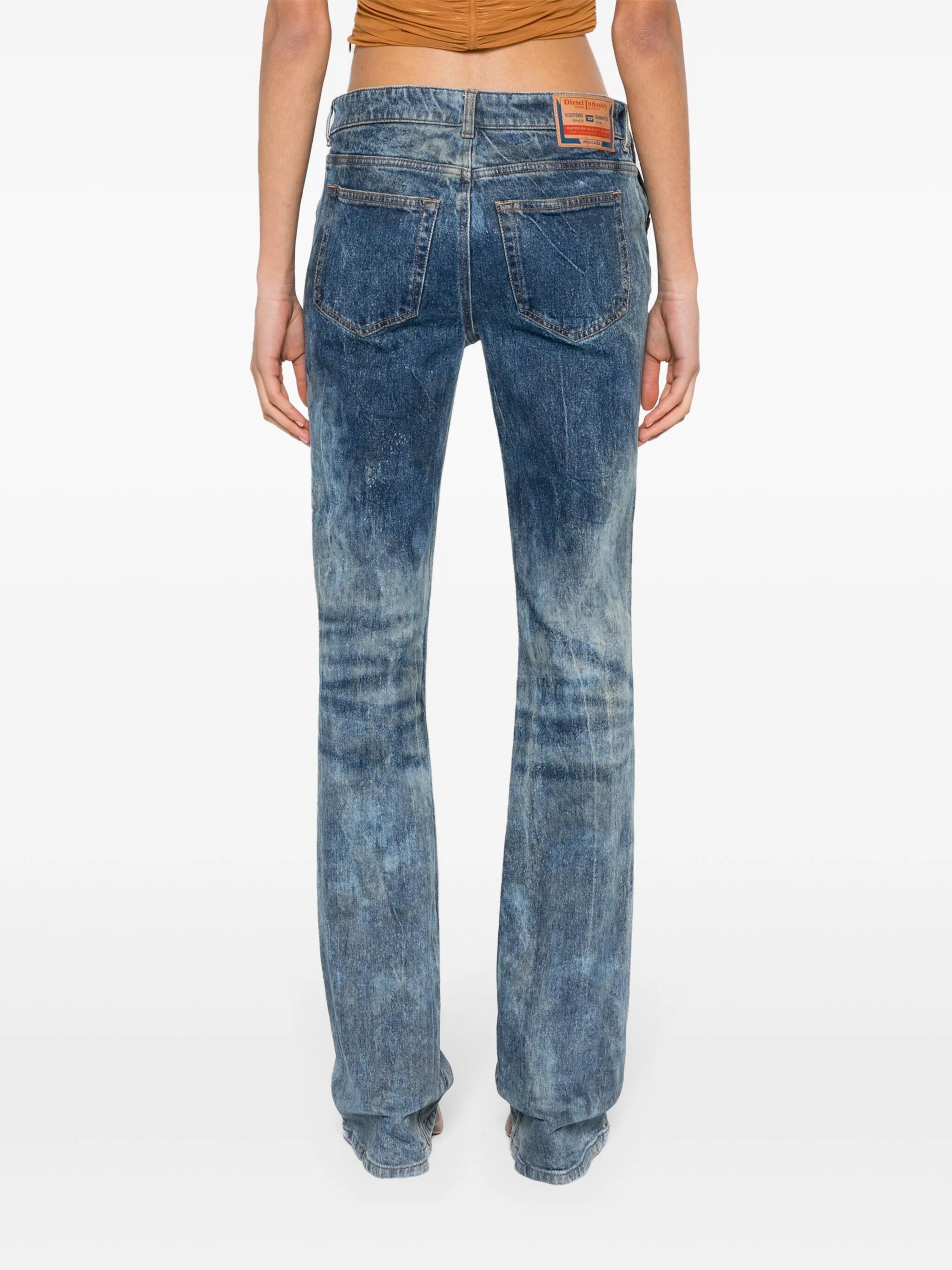 gem-logo buckle flared jeans