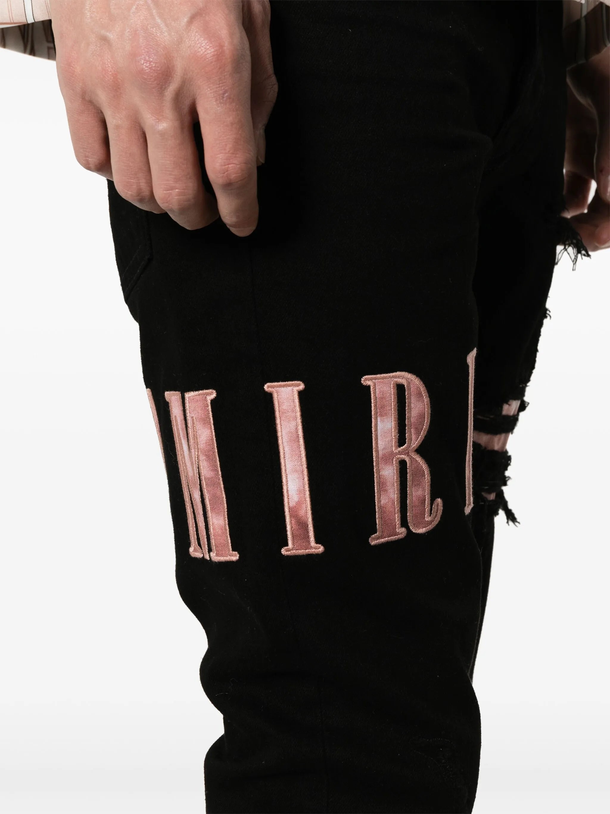 waxed logo-appliqué skinny jeans