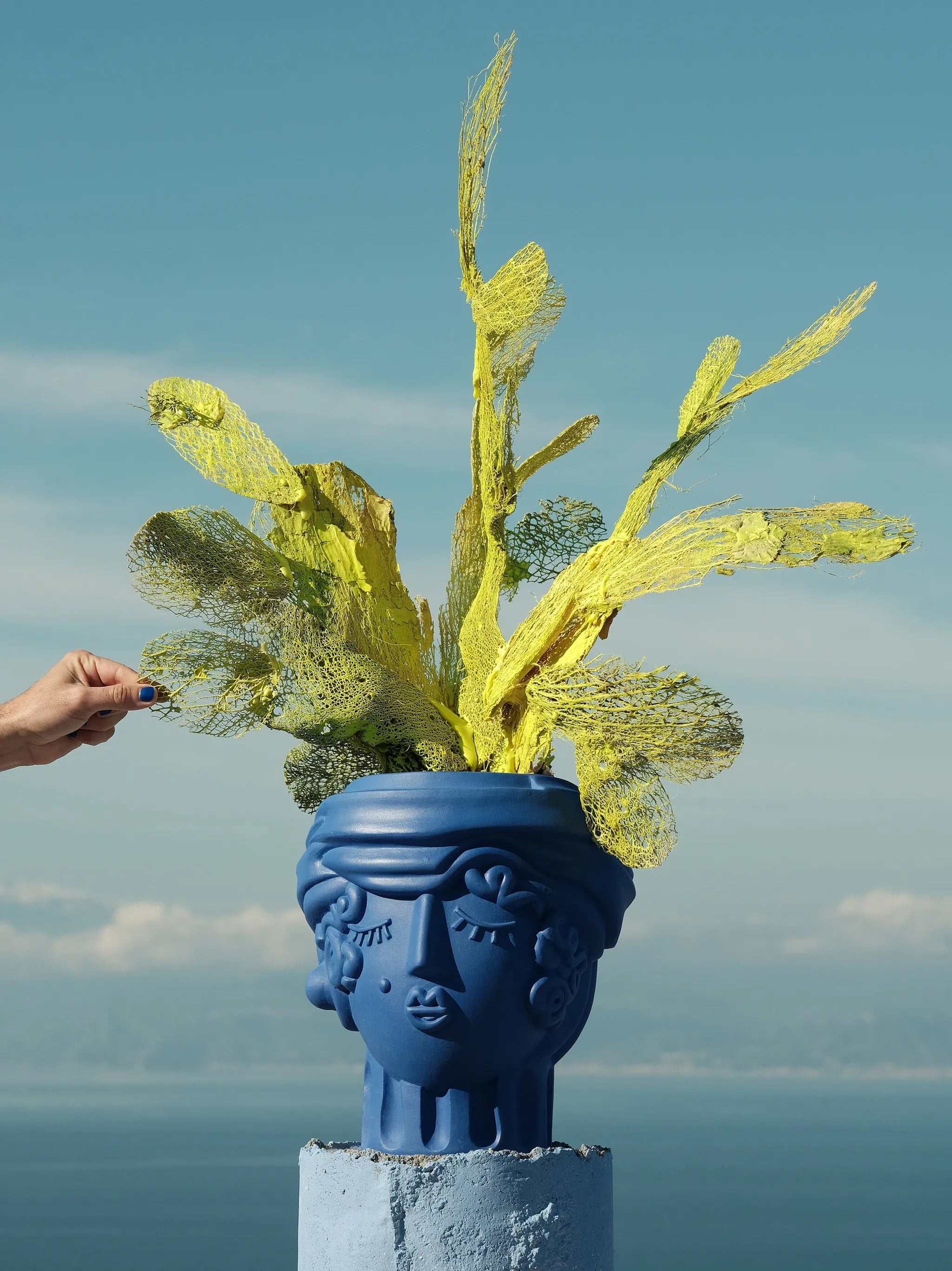 Terracotta vase women blue