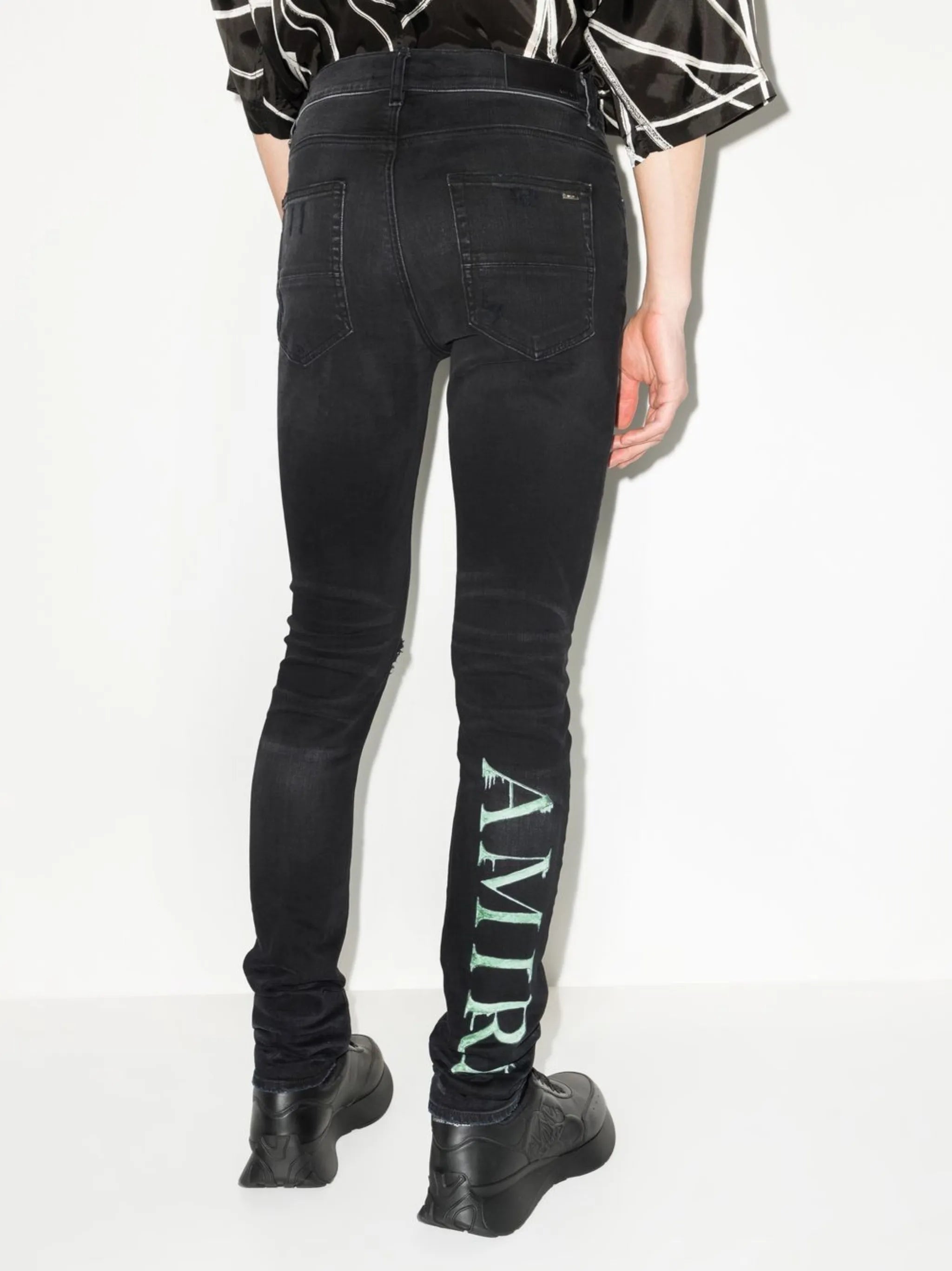 Watercolour logo-print skinny jeans