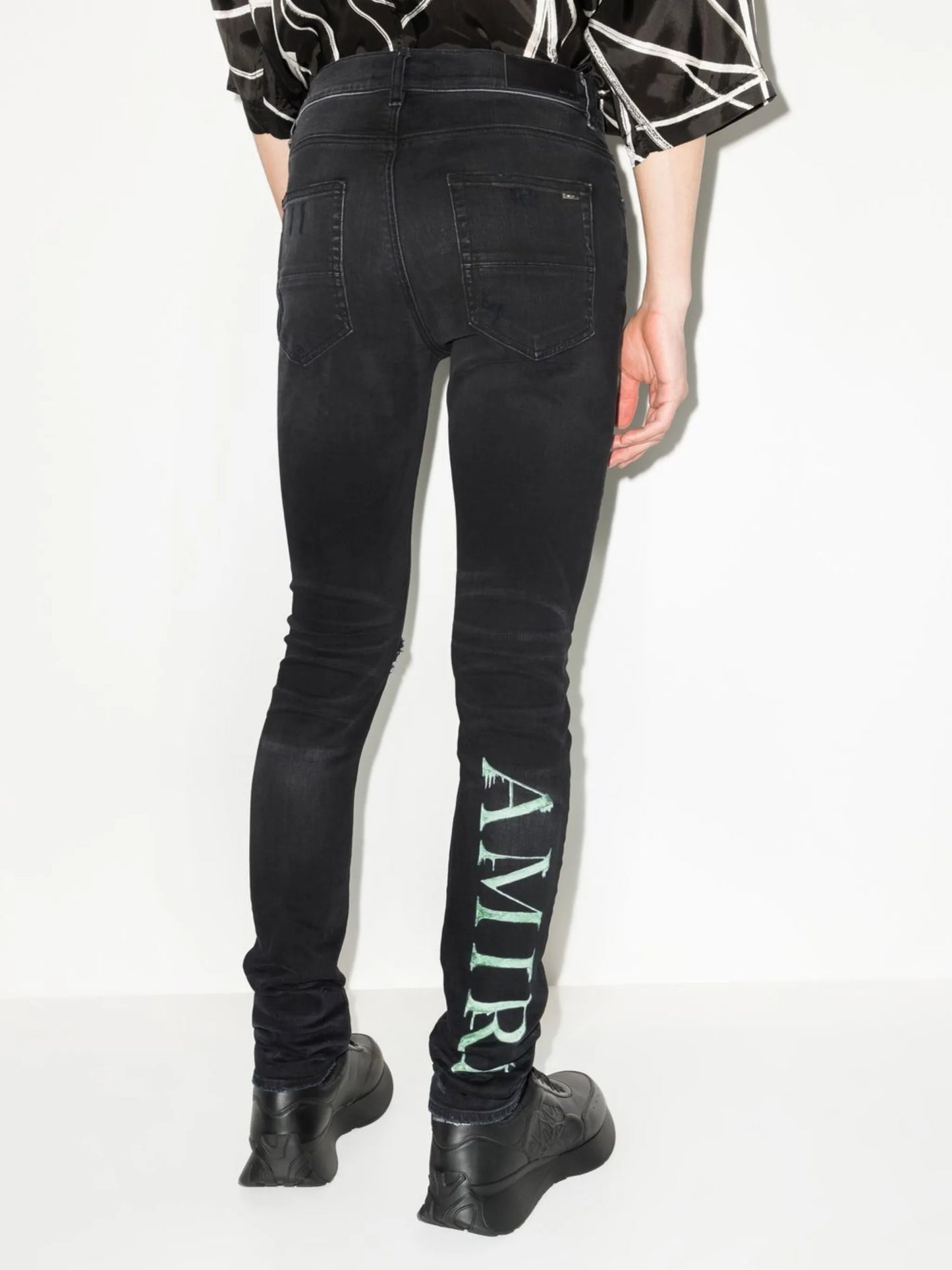 Watercolour logo-print skinny jeans