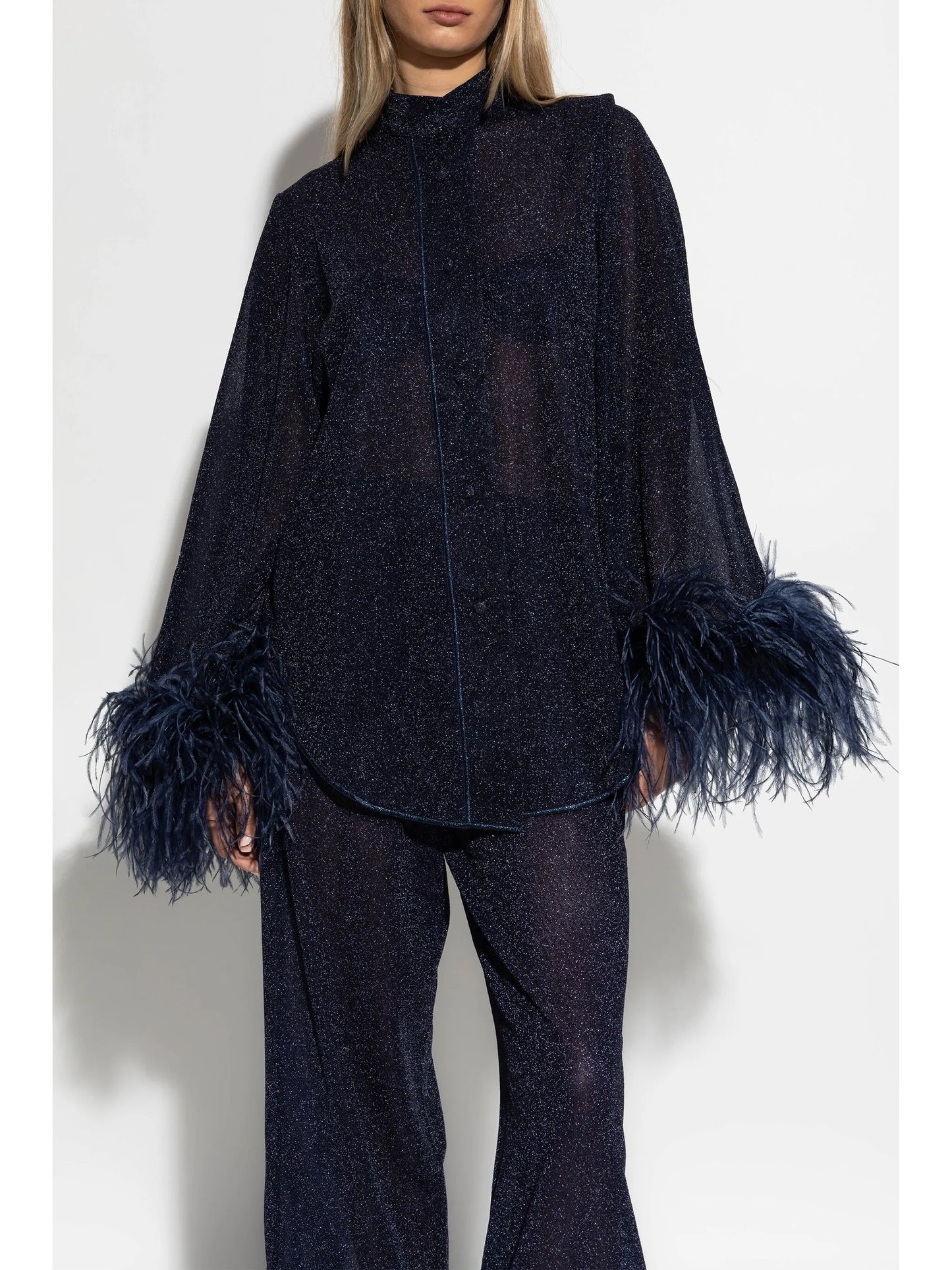 feather-embellished blouse