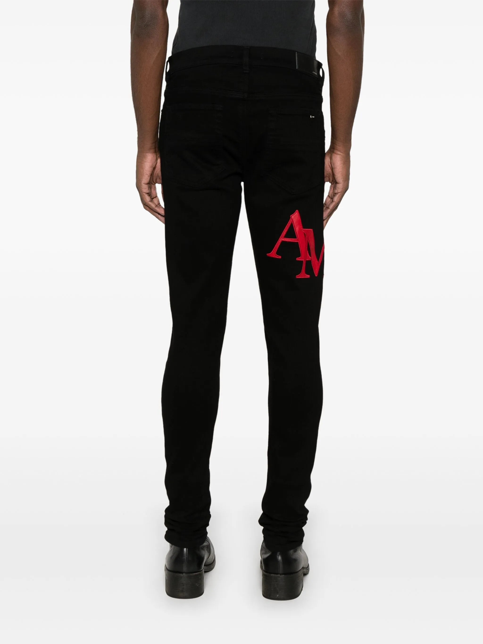 Staggered-logo-embroidered jeans