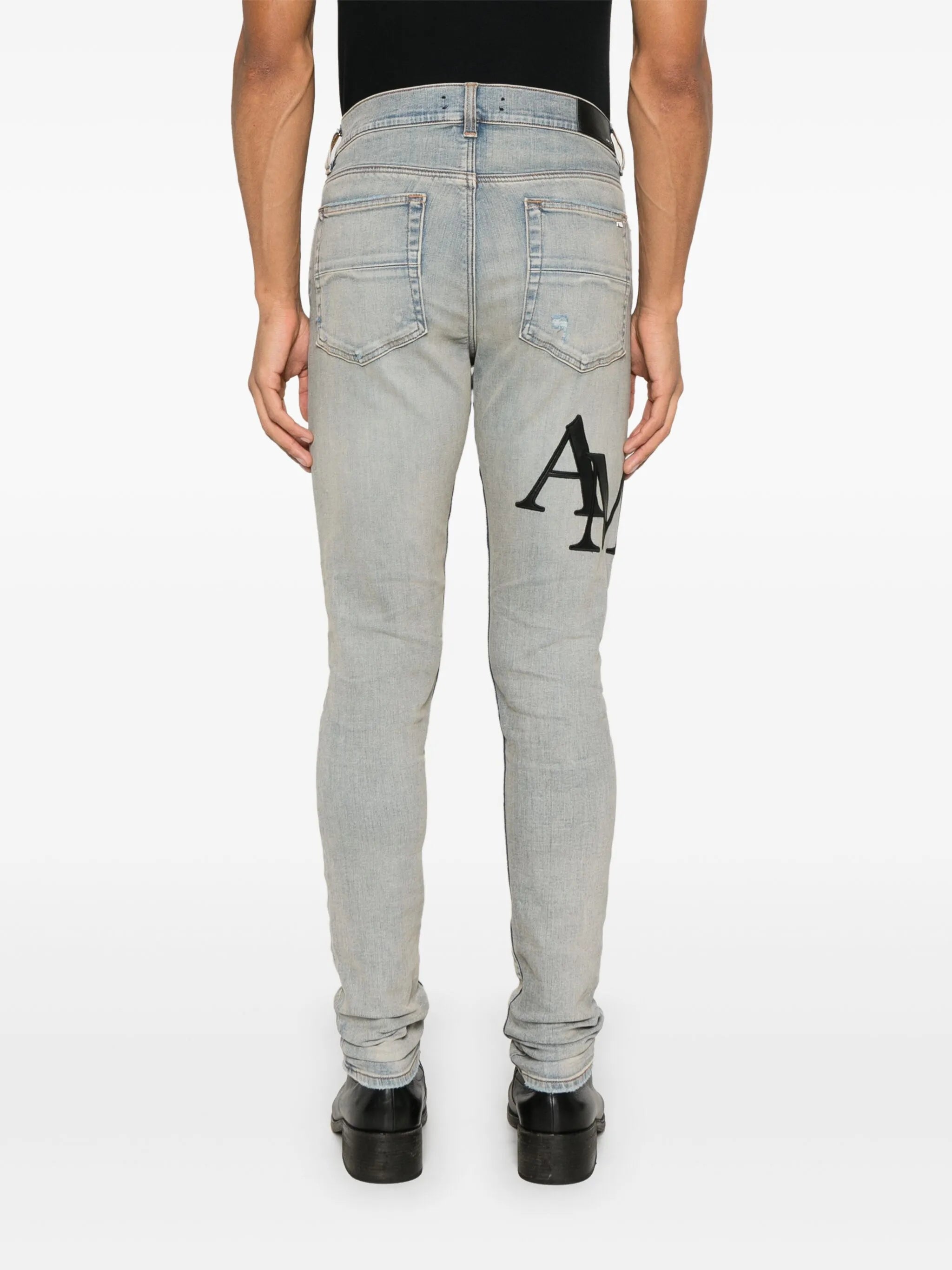 staggered logo skinny jeans - black red