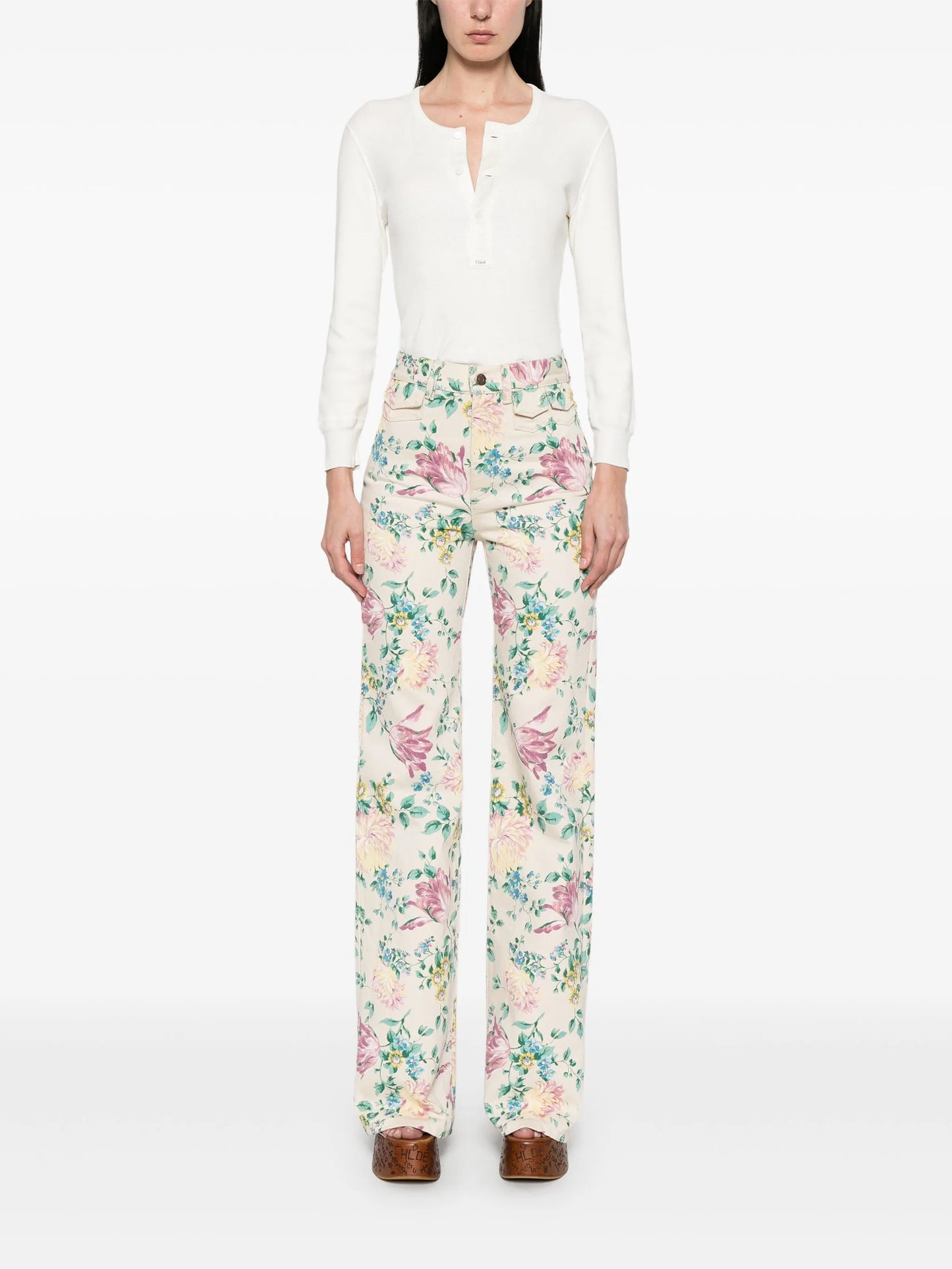 high-waisted floral-print jeans