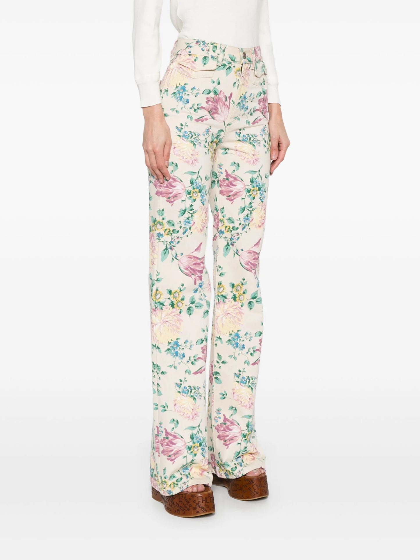 high-waisted floral-print jeans