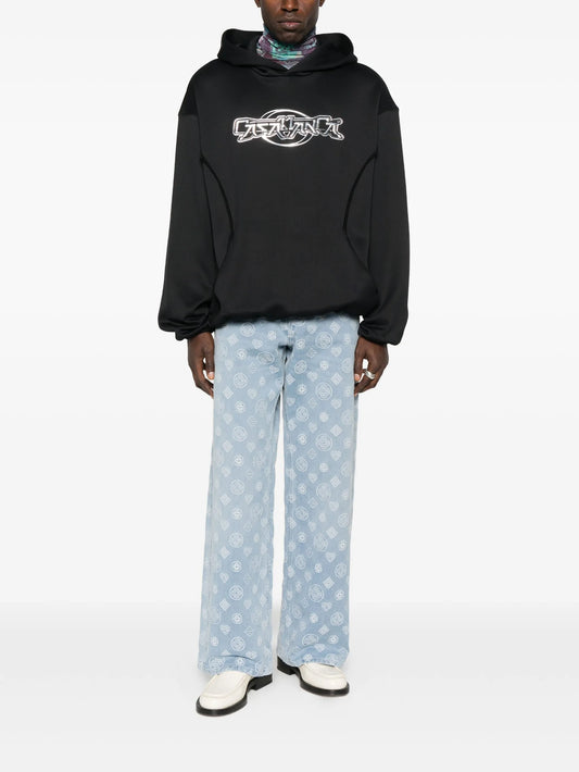 monogram-pattern jeans