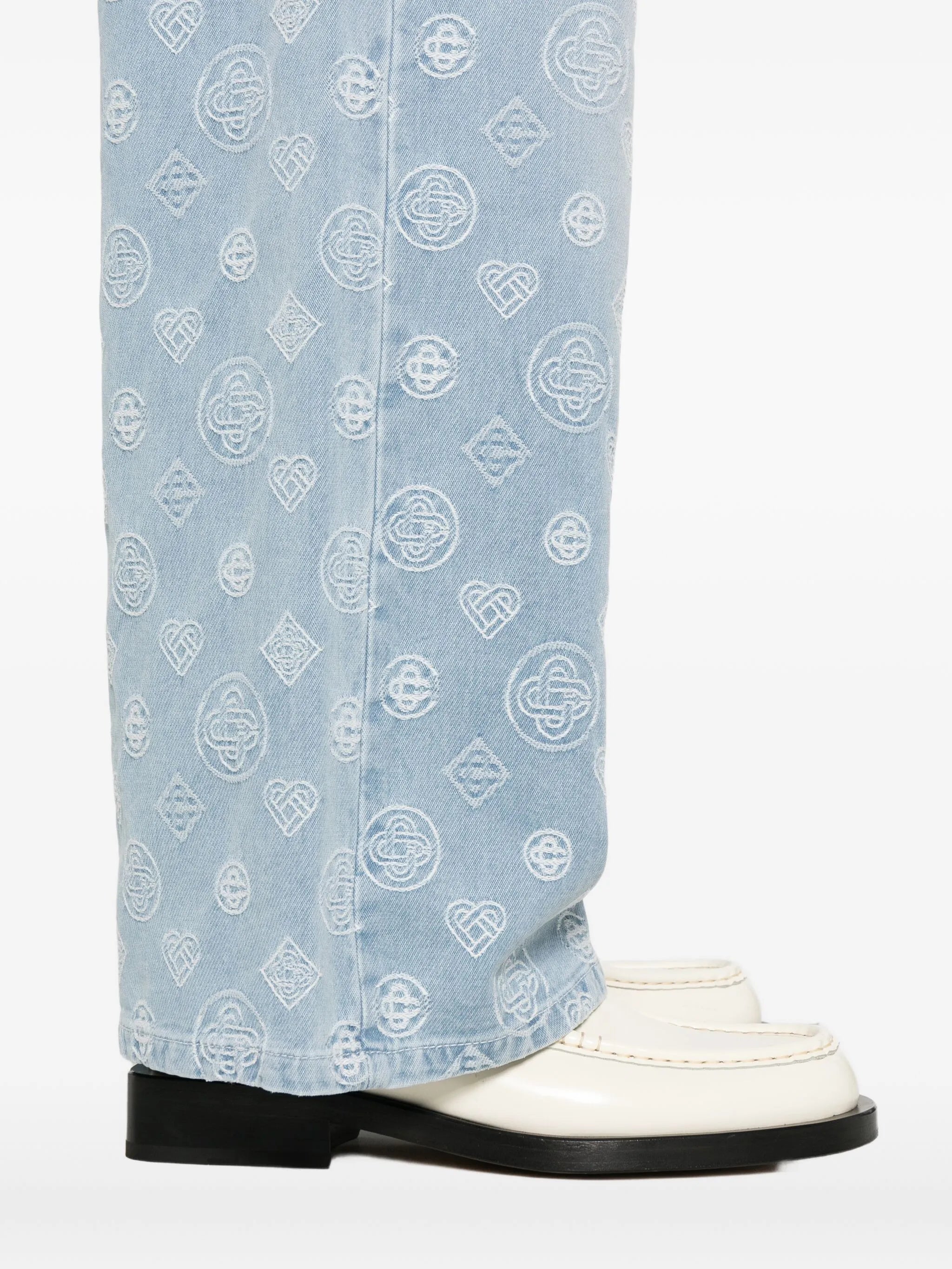 monogram-pattern jeans