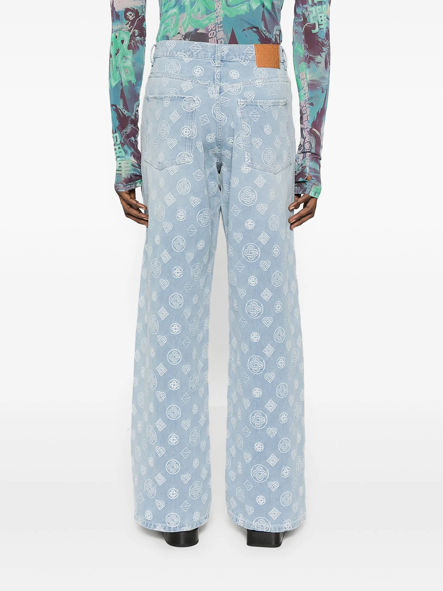 monogram-pattern jeans