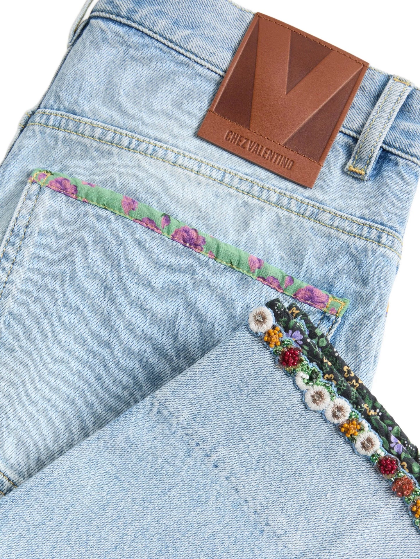 floral-hem faded jeans