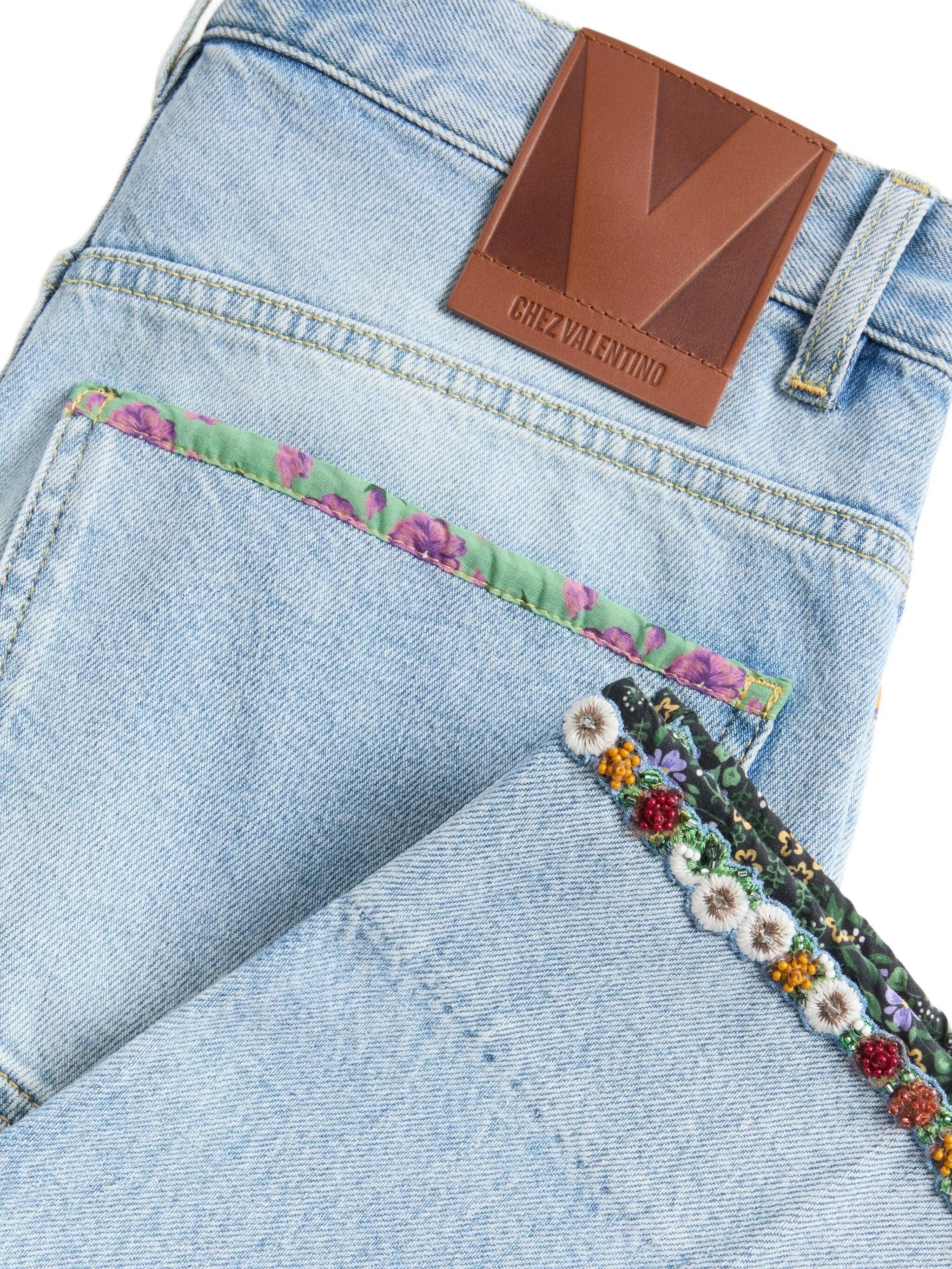 floral-hem faded jeans