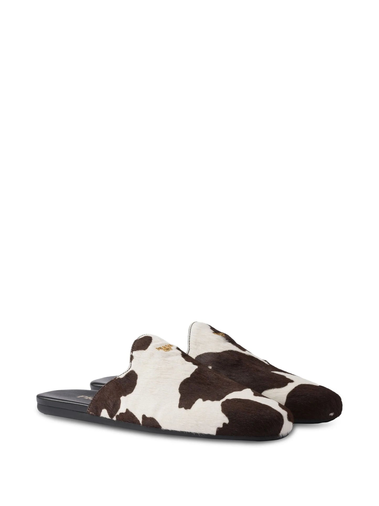 cow-print slip-on mules