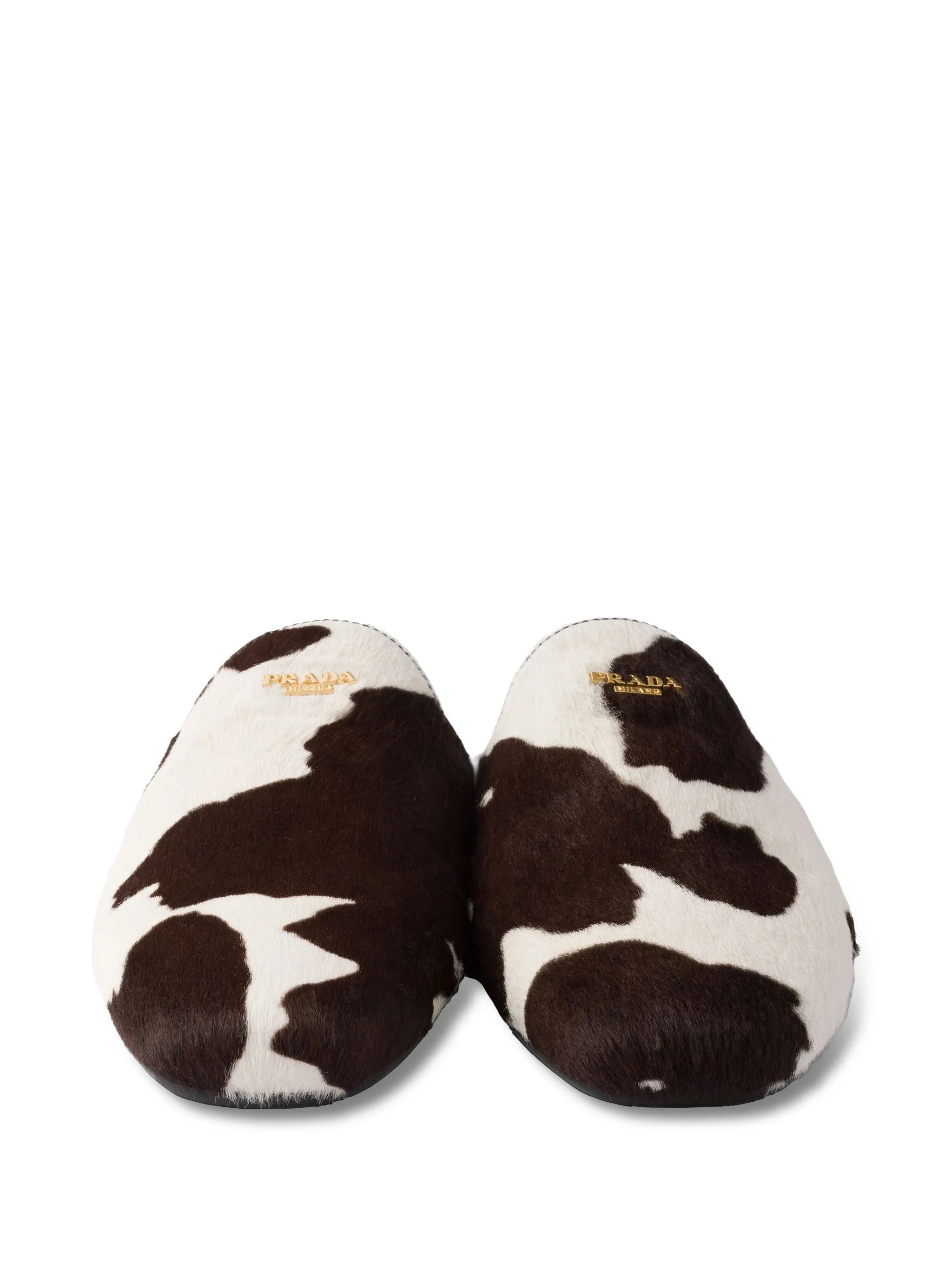 cow-print slip-on mules