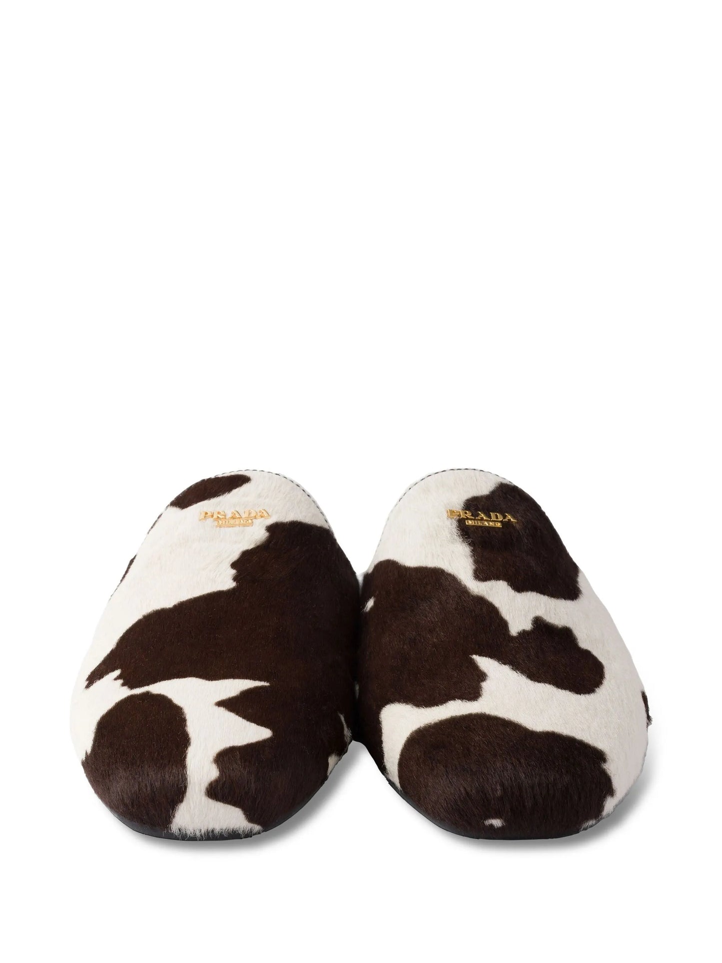 cow-print slip-on mules