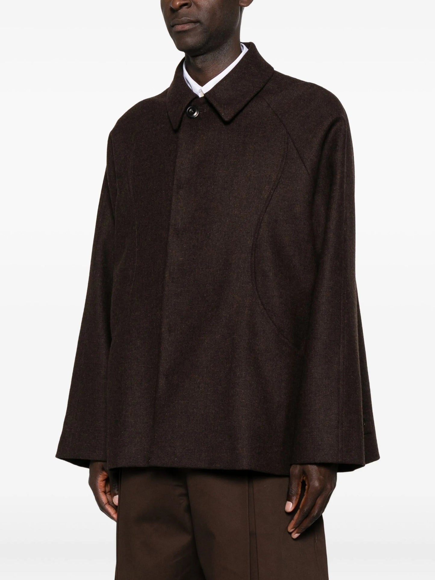 curved-pocket herringbone-pattern overcoat