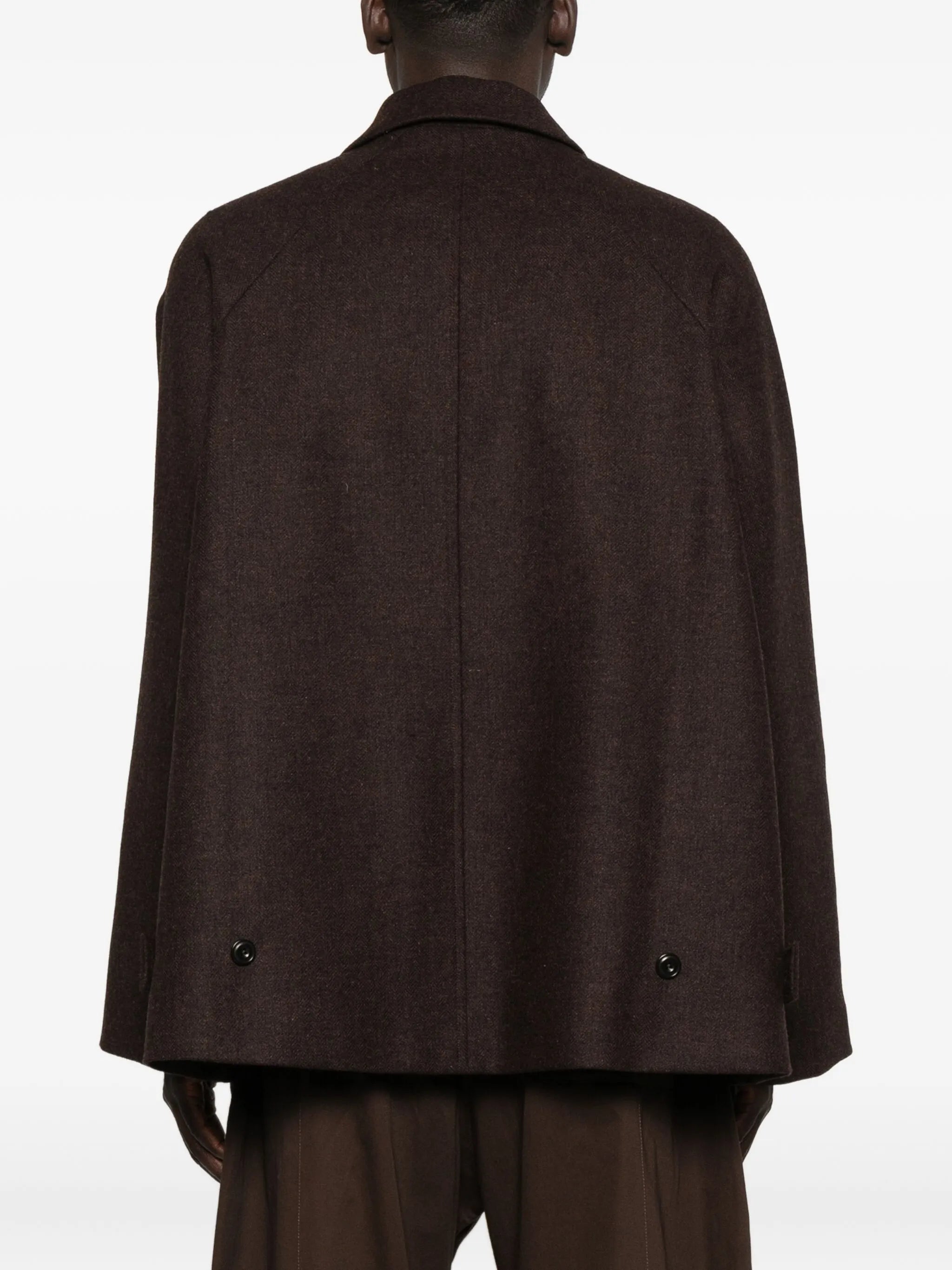 curved-pocket herringbone-pattern overcoat