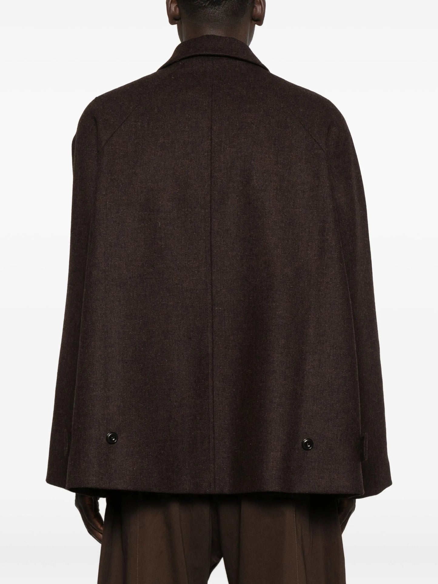 curved-pocket herringbone-pattern overcoat