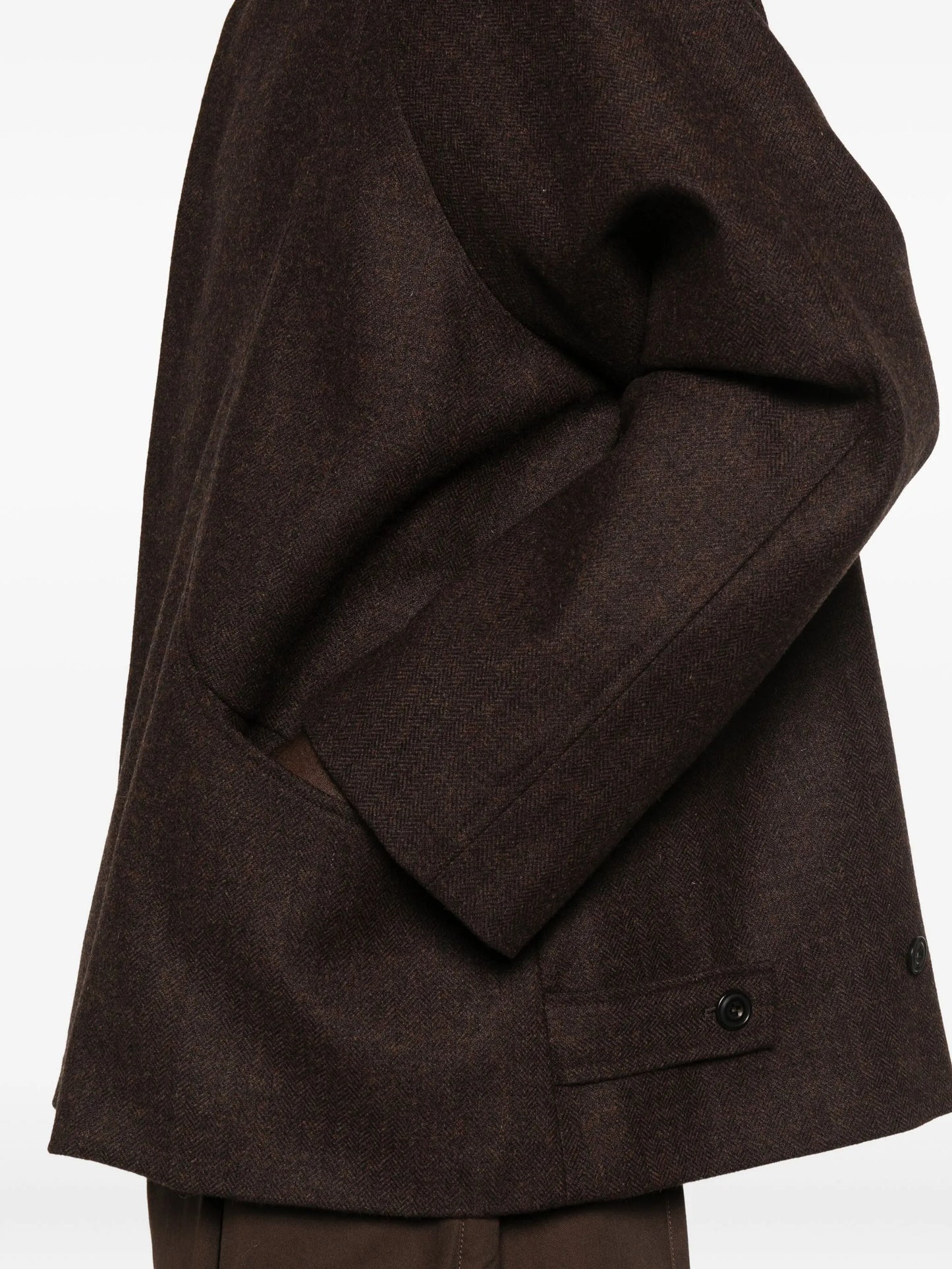 curved-pocket herringbone-pattern overcoat