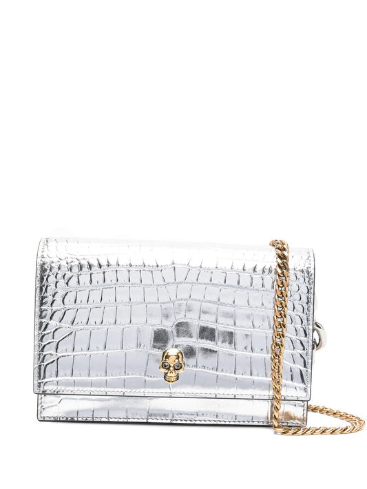 skull-embellished crocodile-effect bag
