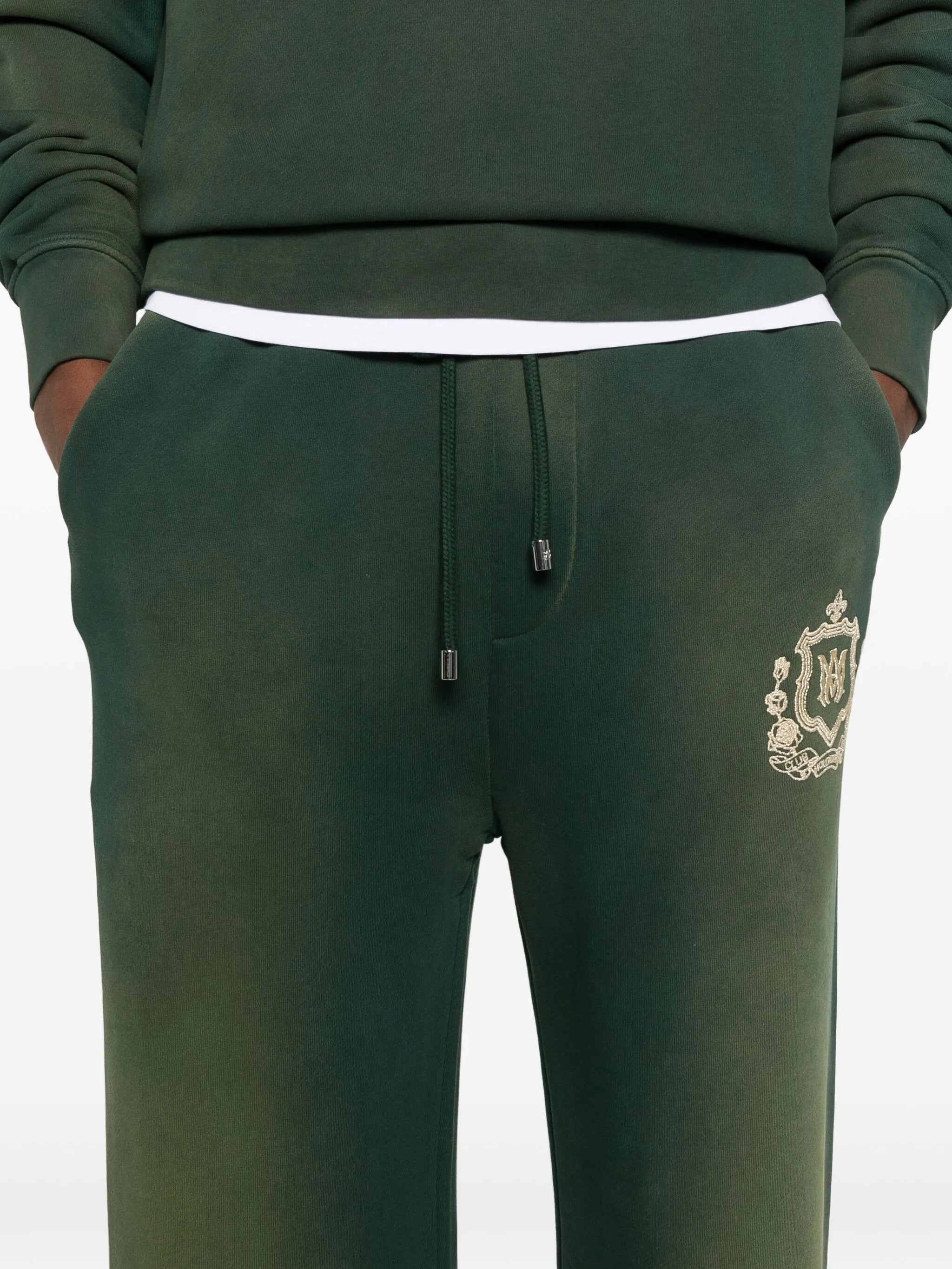 crest-embellished track pants