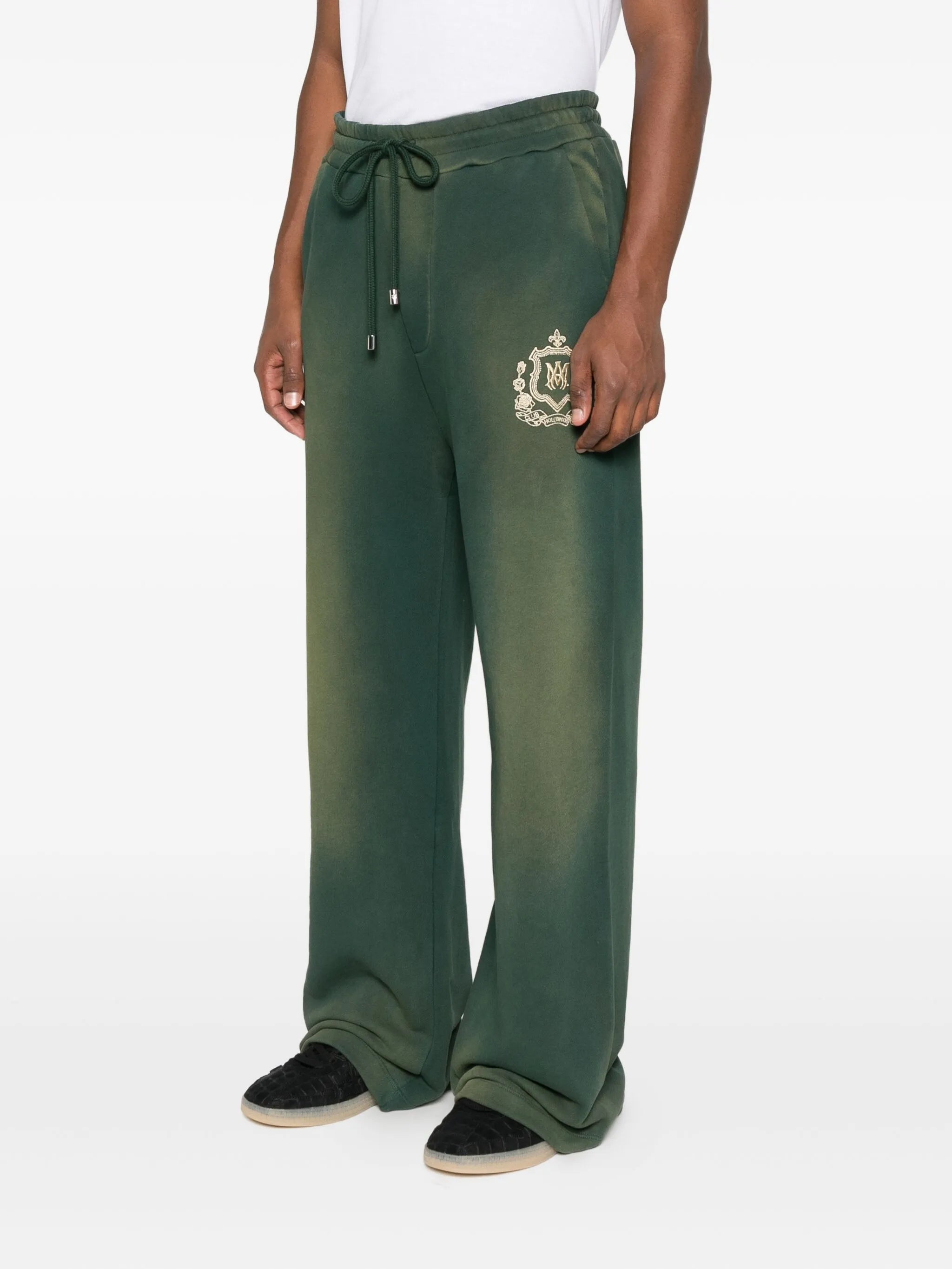 crest-embellished track pants