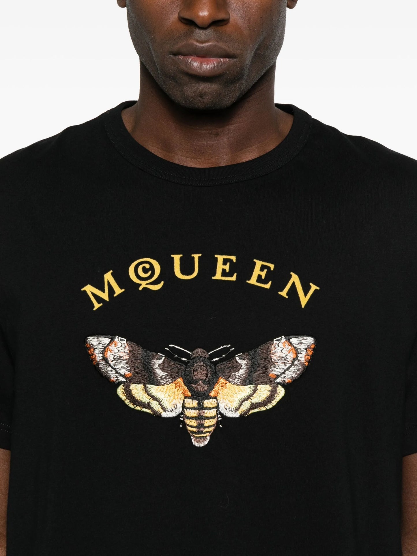 moth-embroidered T-shirt