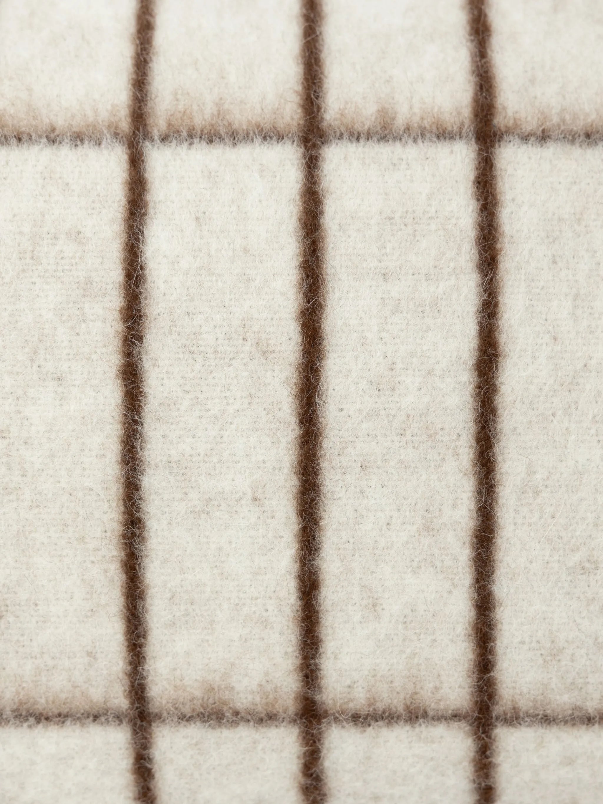 grid-pattern wool cushion