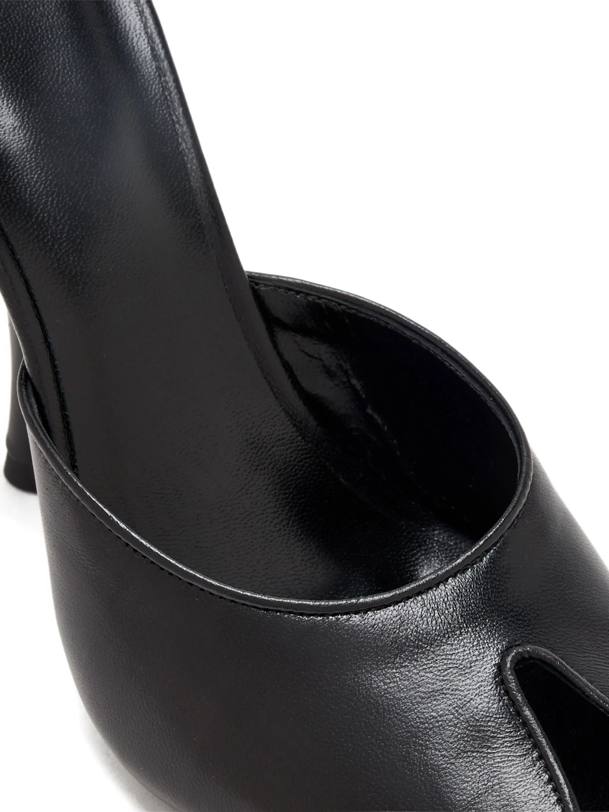 Date mules in black creased leather