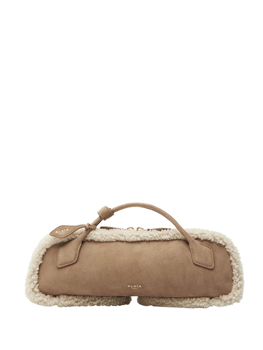 Le Teckel shearling clutch bag