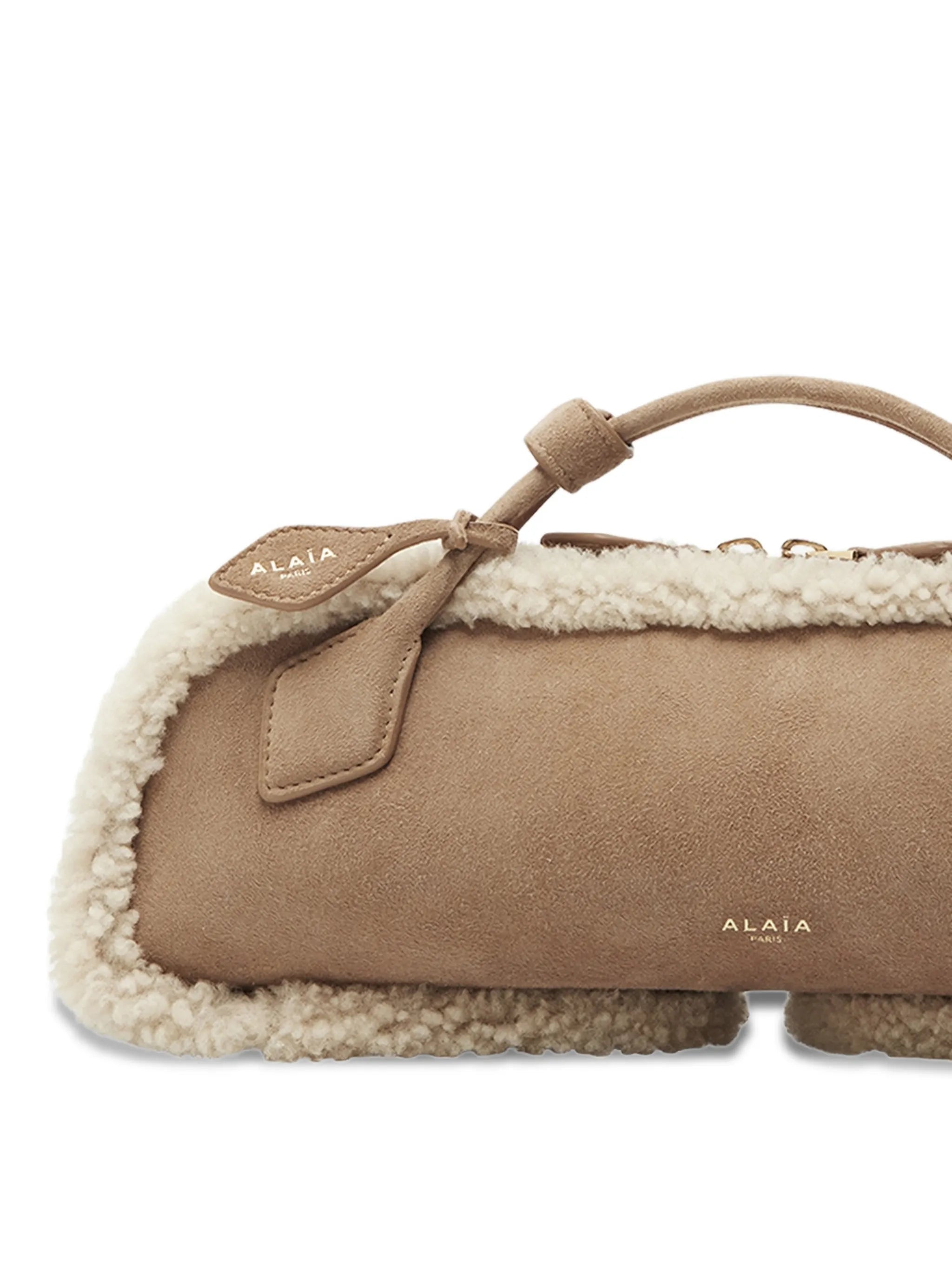 Le Teckel shearling clutch bag