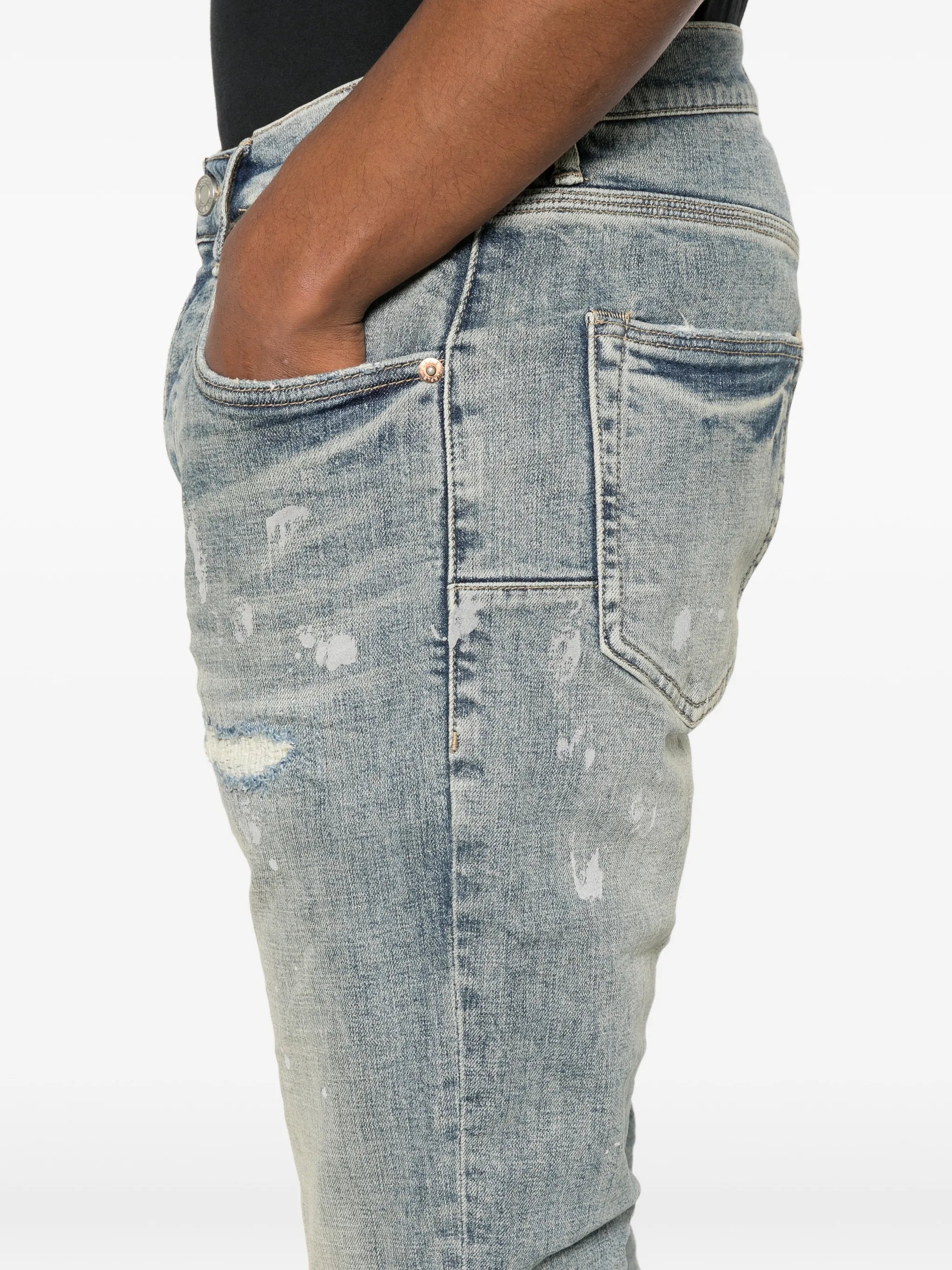 slashed paint jeans