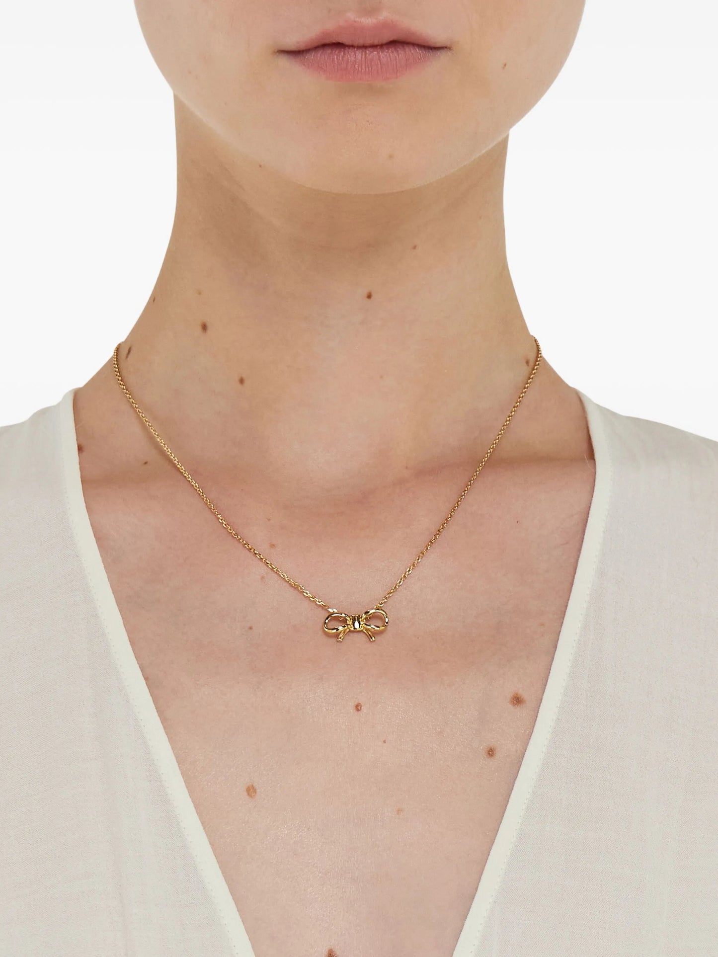 necklace with bow pendant