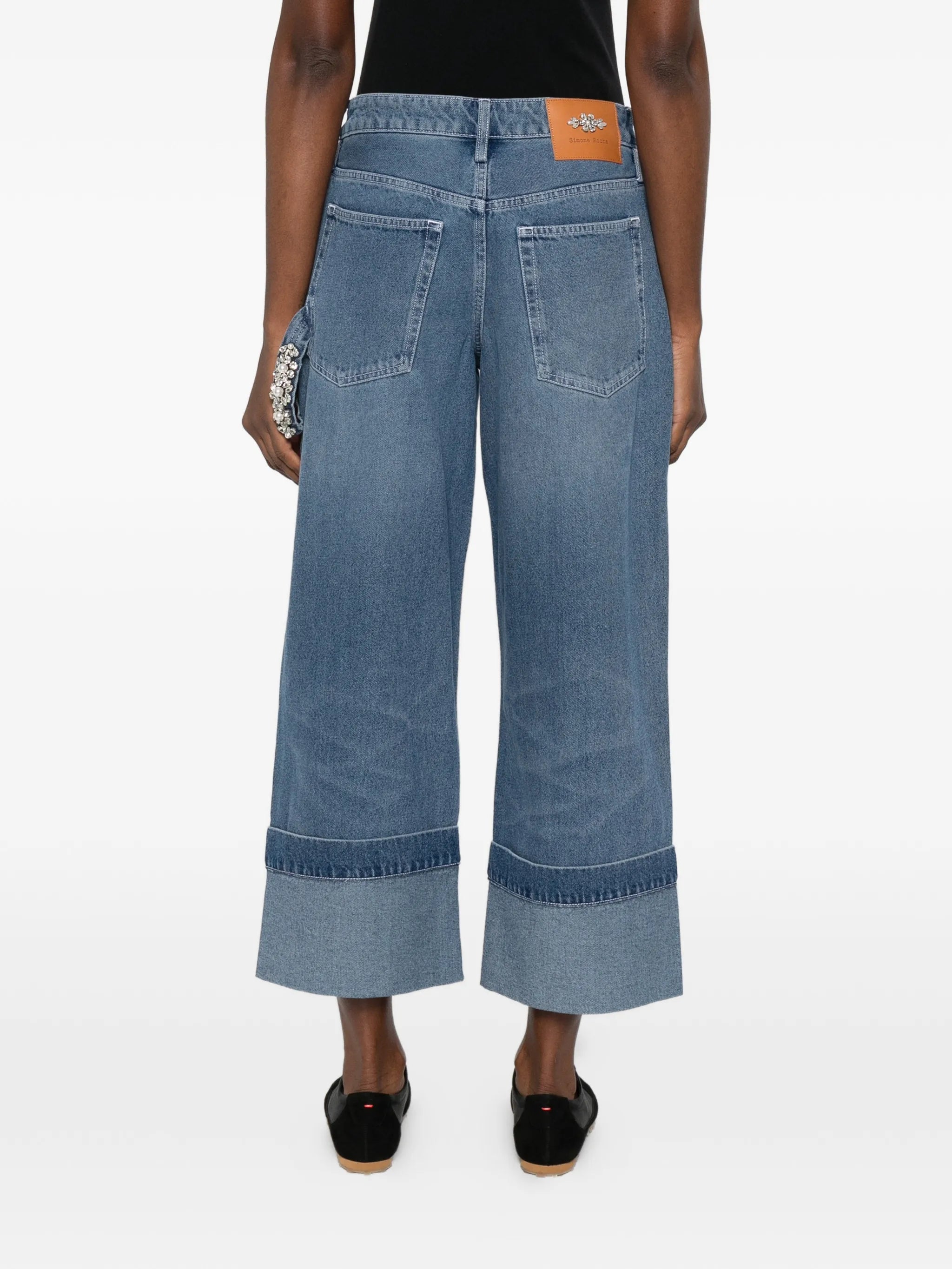 strap-ebellished jeans