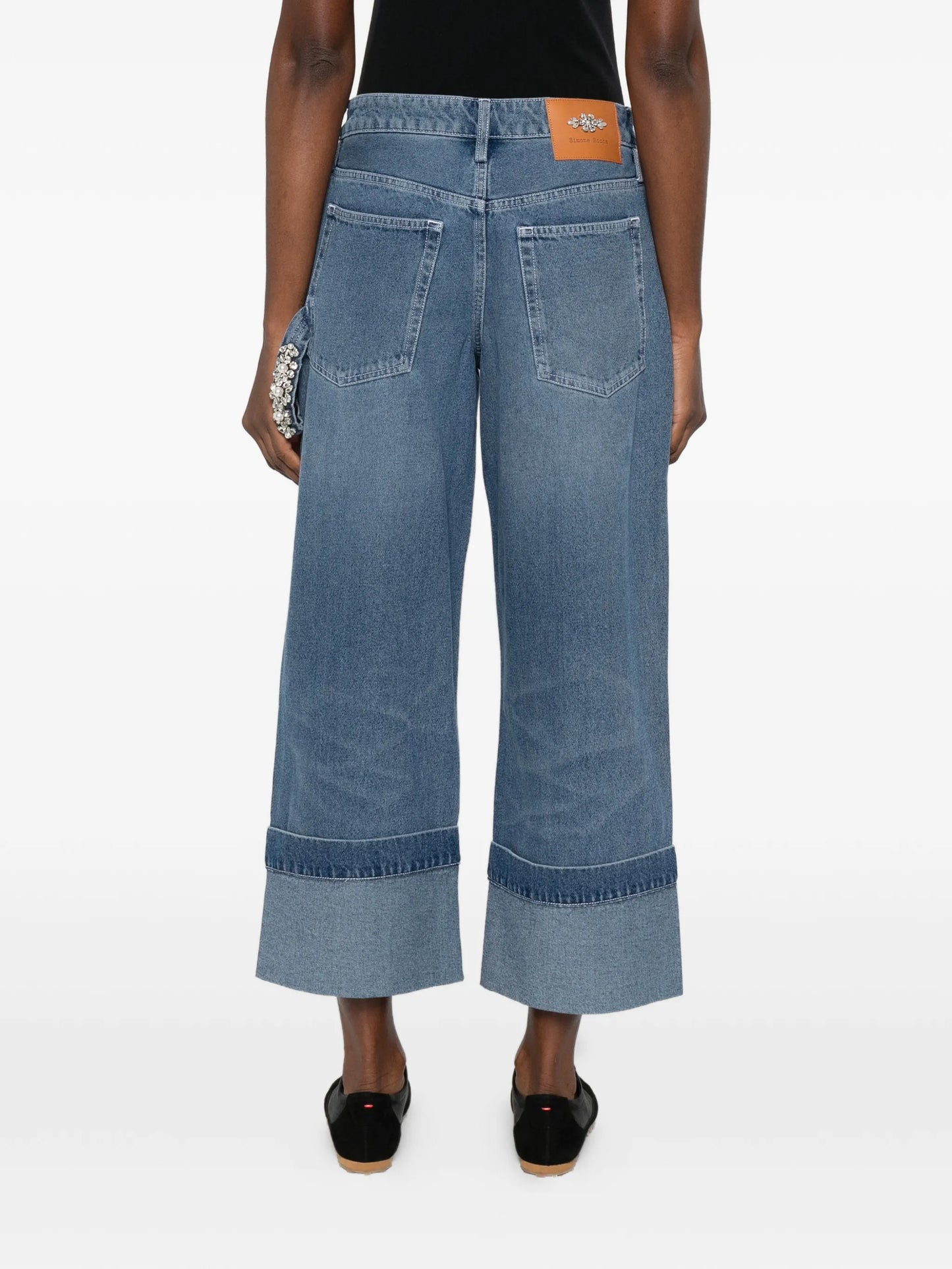 strap-ebellished jeans