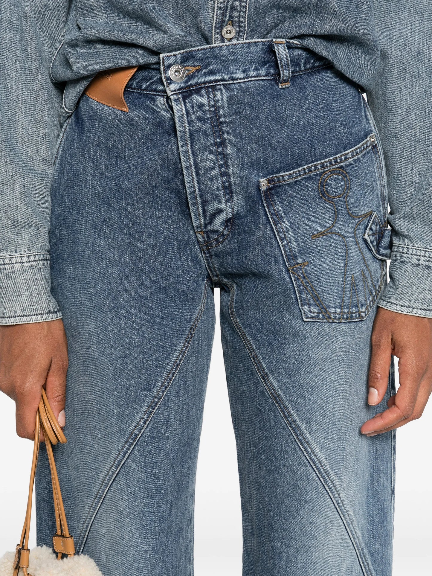 twisted-effect logo-patch denim jeans