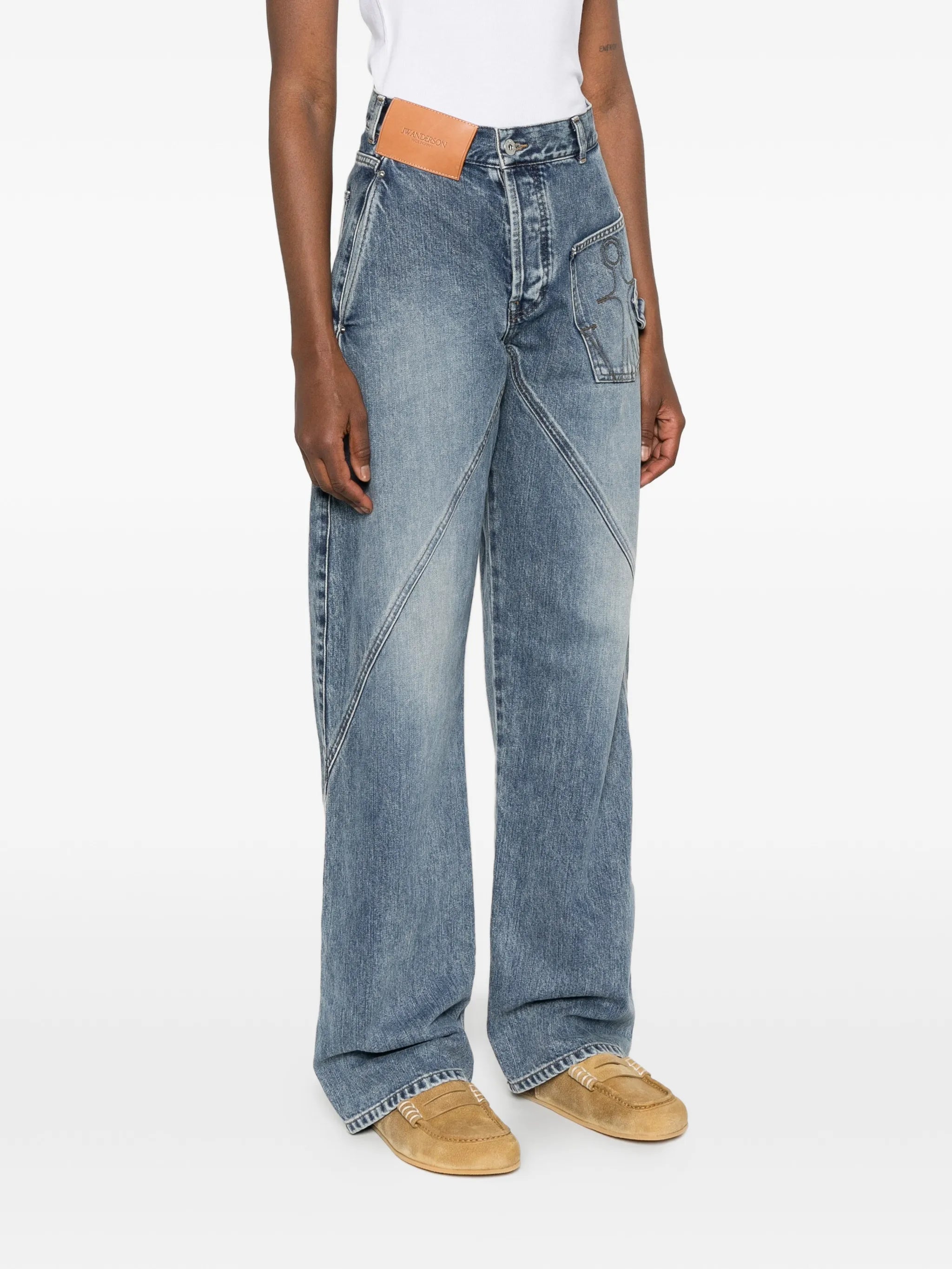 twisted-effect logo-patch jeans
