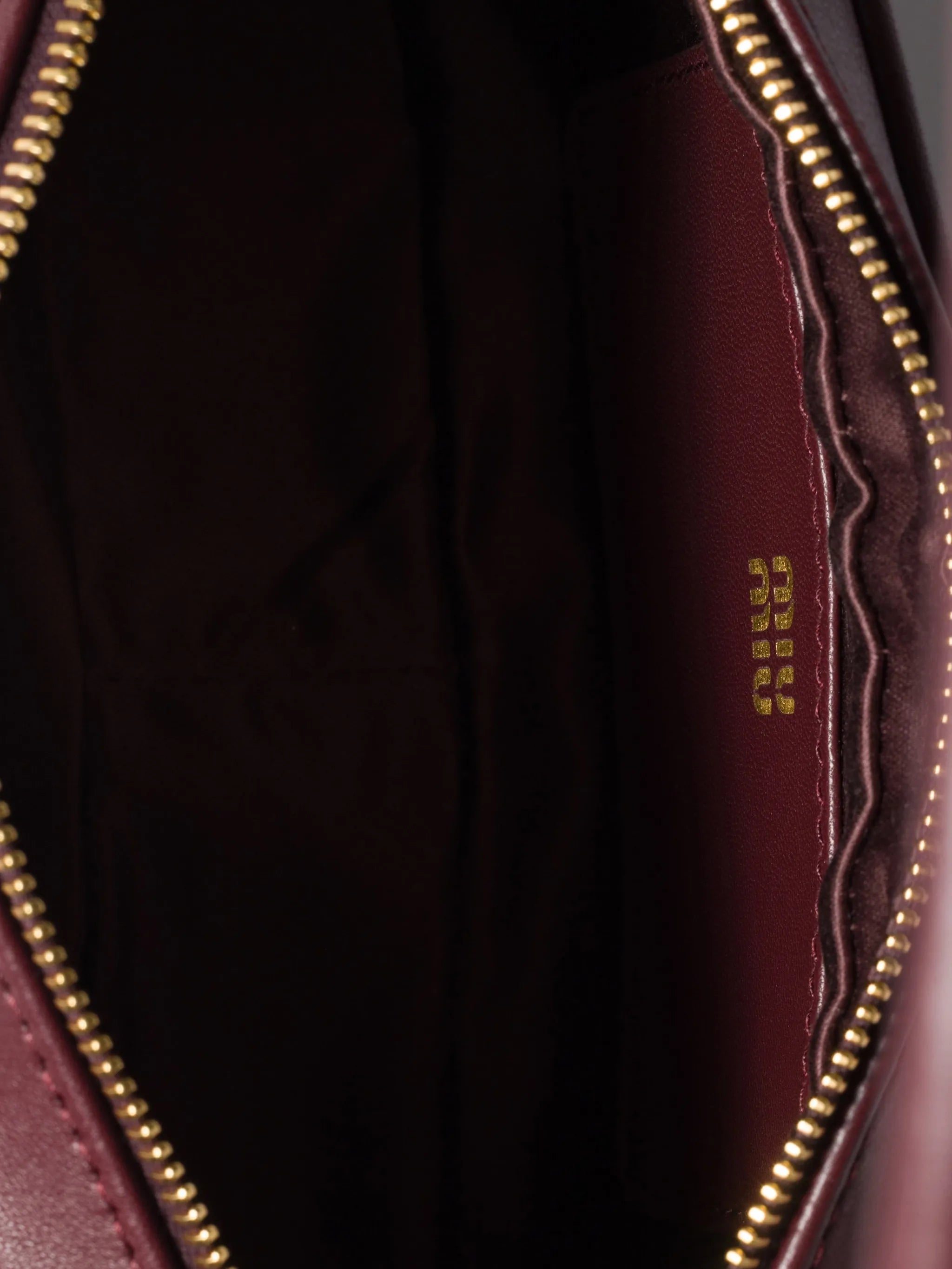 adjustable-strap leather clutch bag