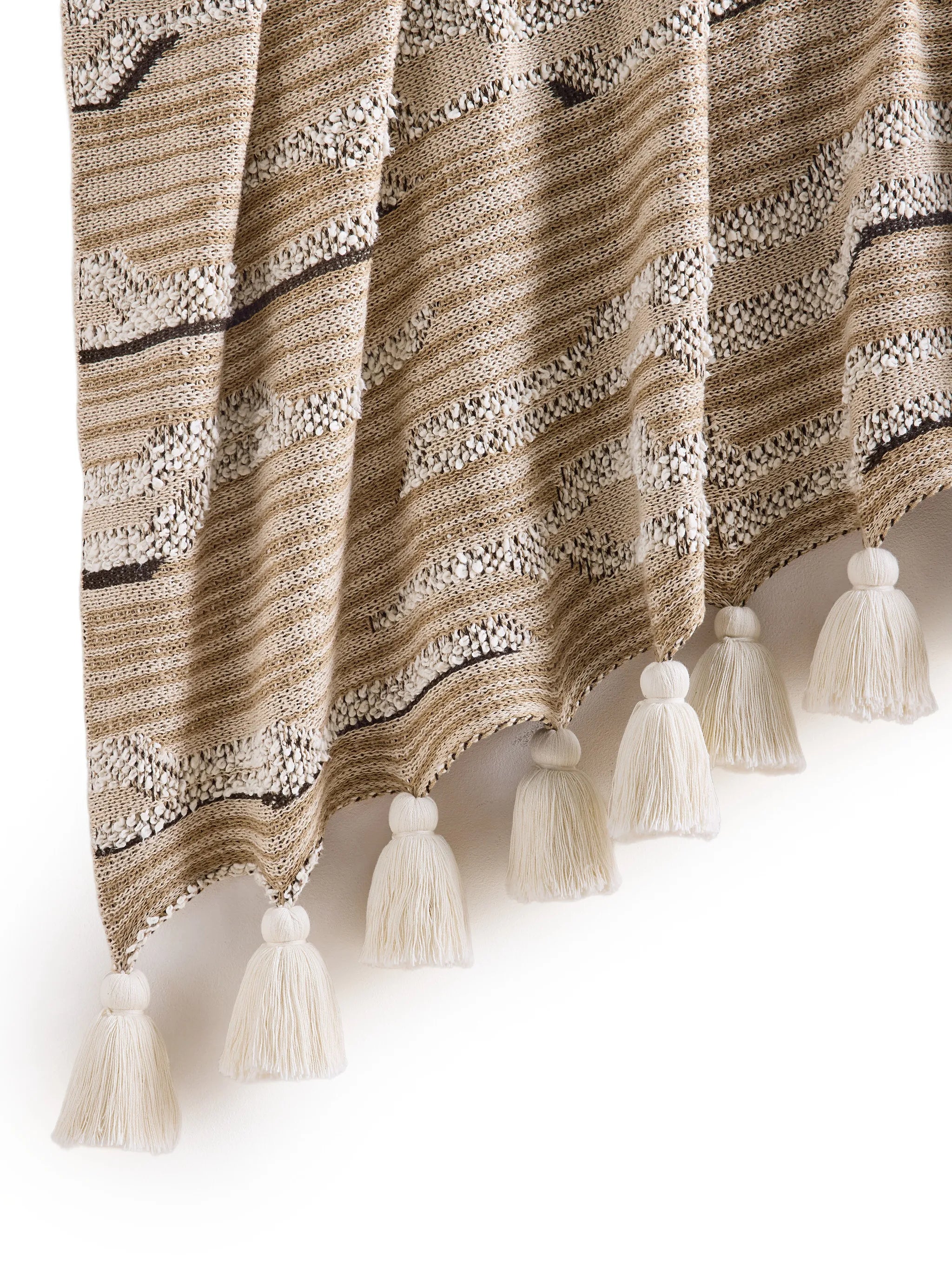 Cloud knitted tassel-detail throw
