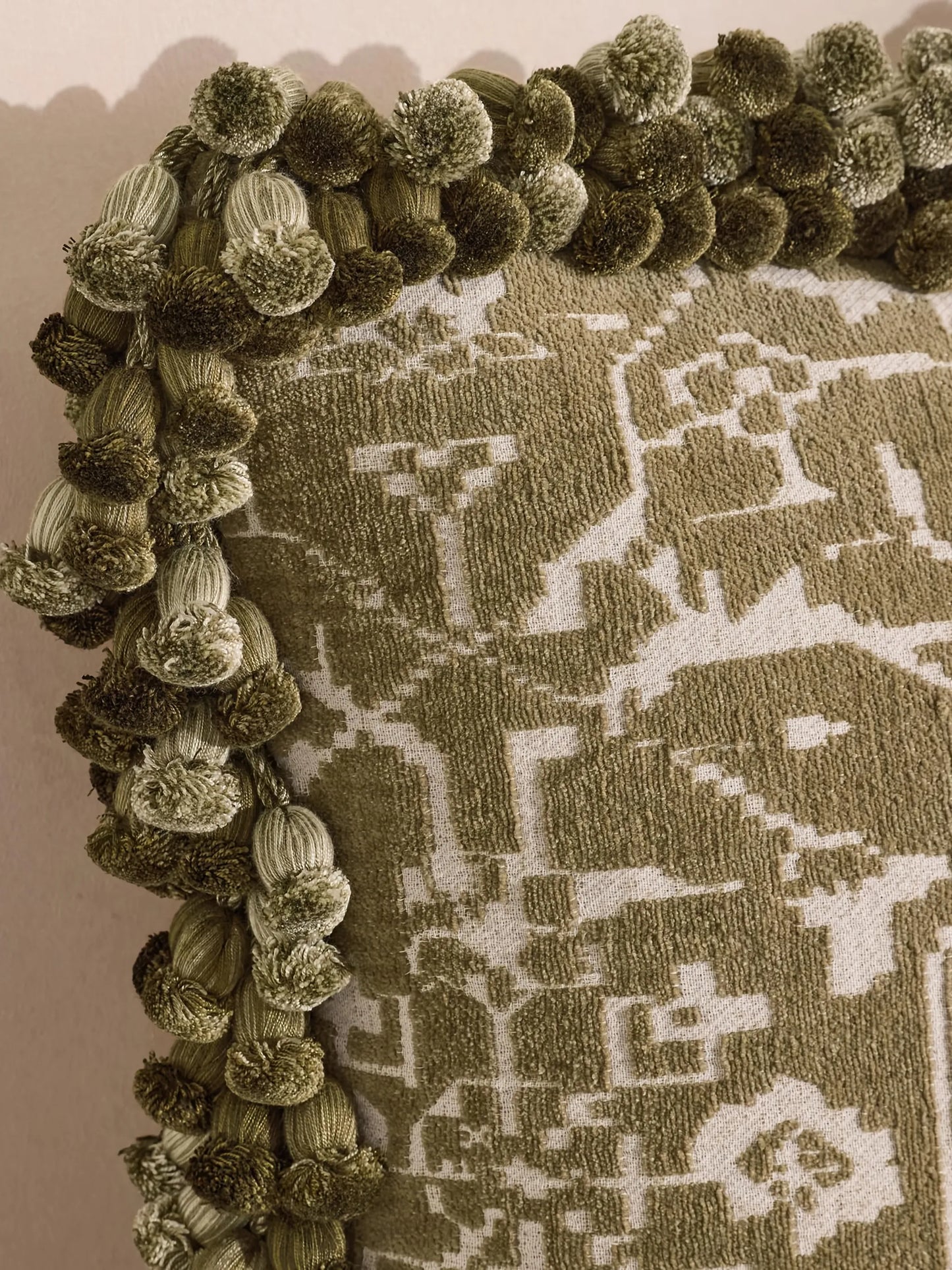 pompom-detail cushion