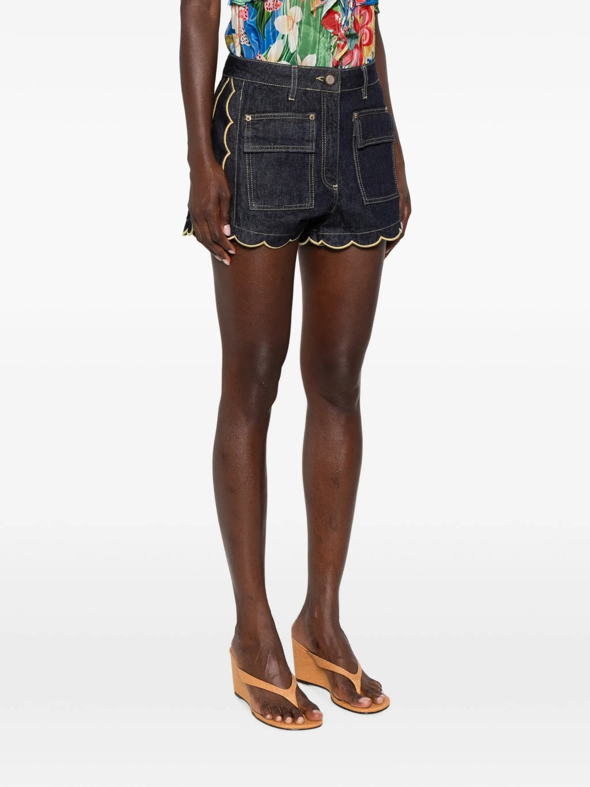 dark denim pockets wavy hem shorts