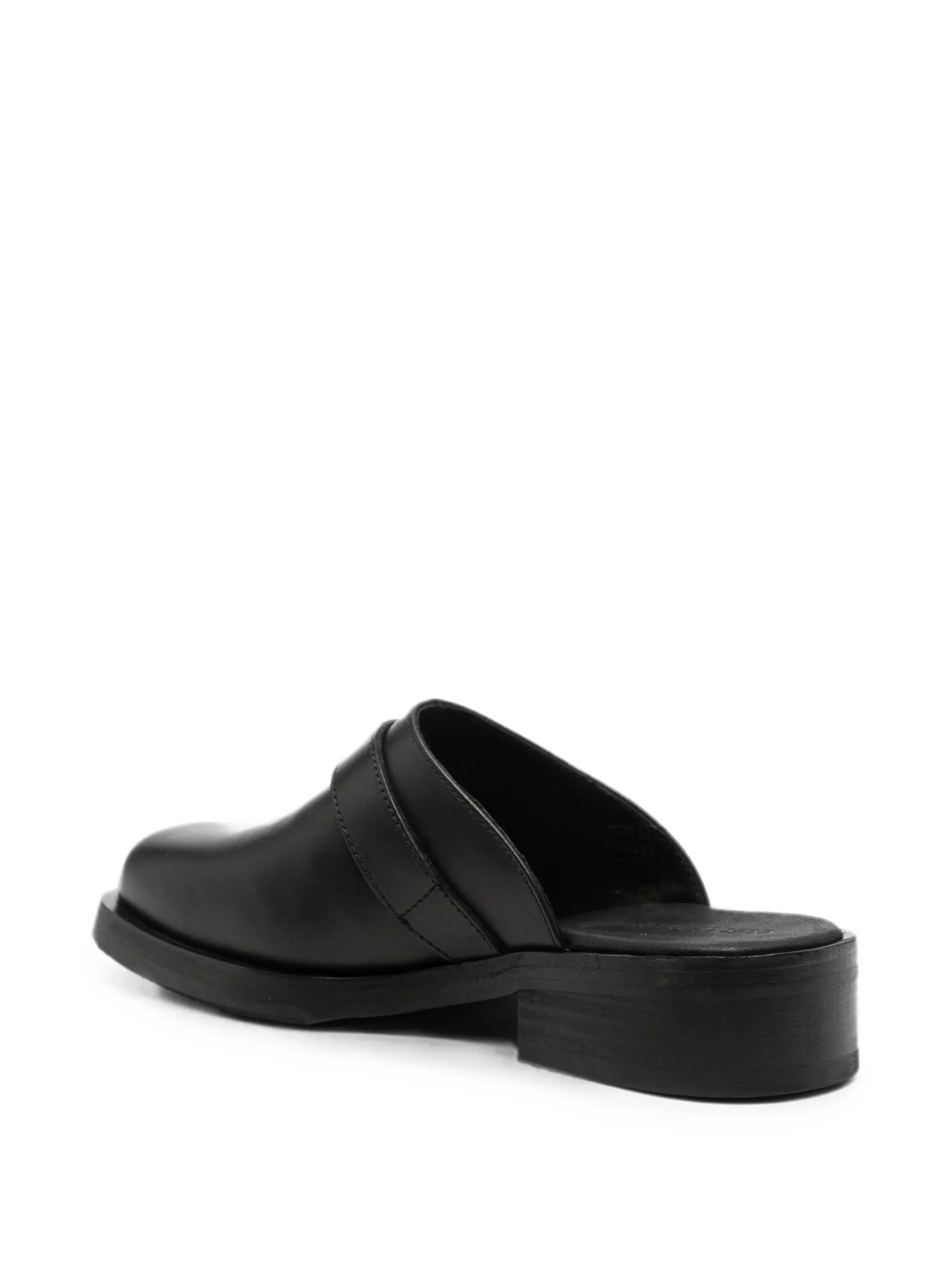 Camion mules in black leather