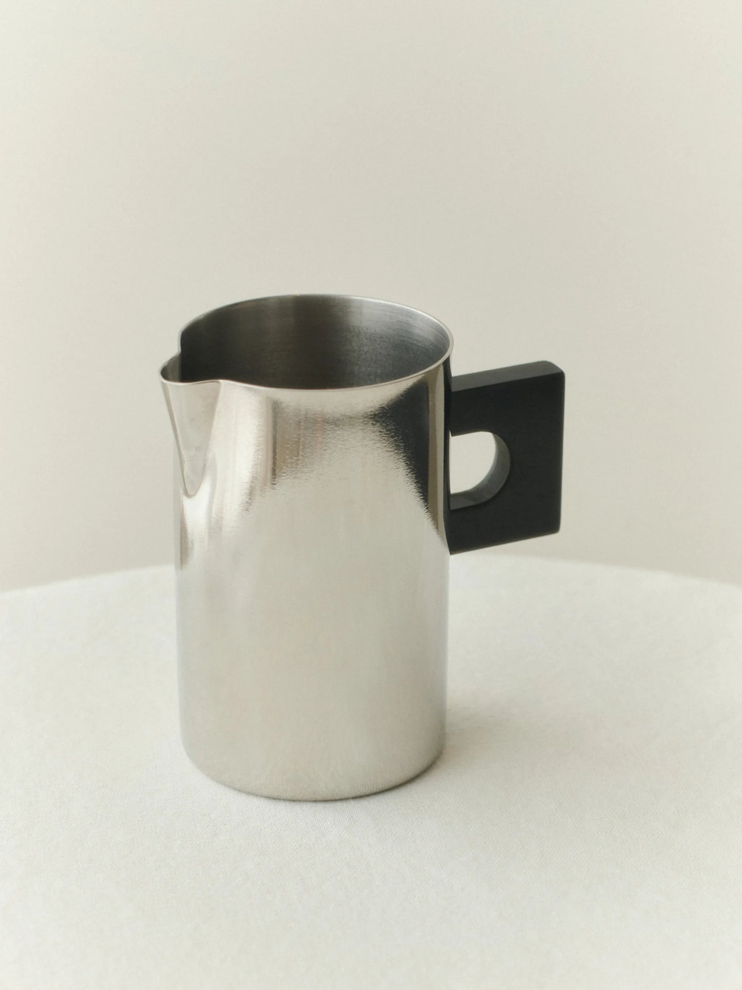 S.R polished-finish geometric-handle pitcher