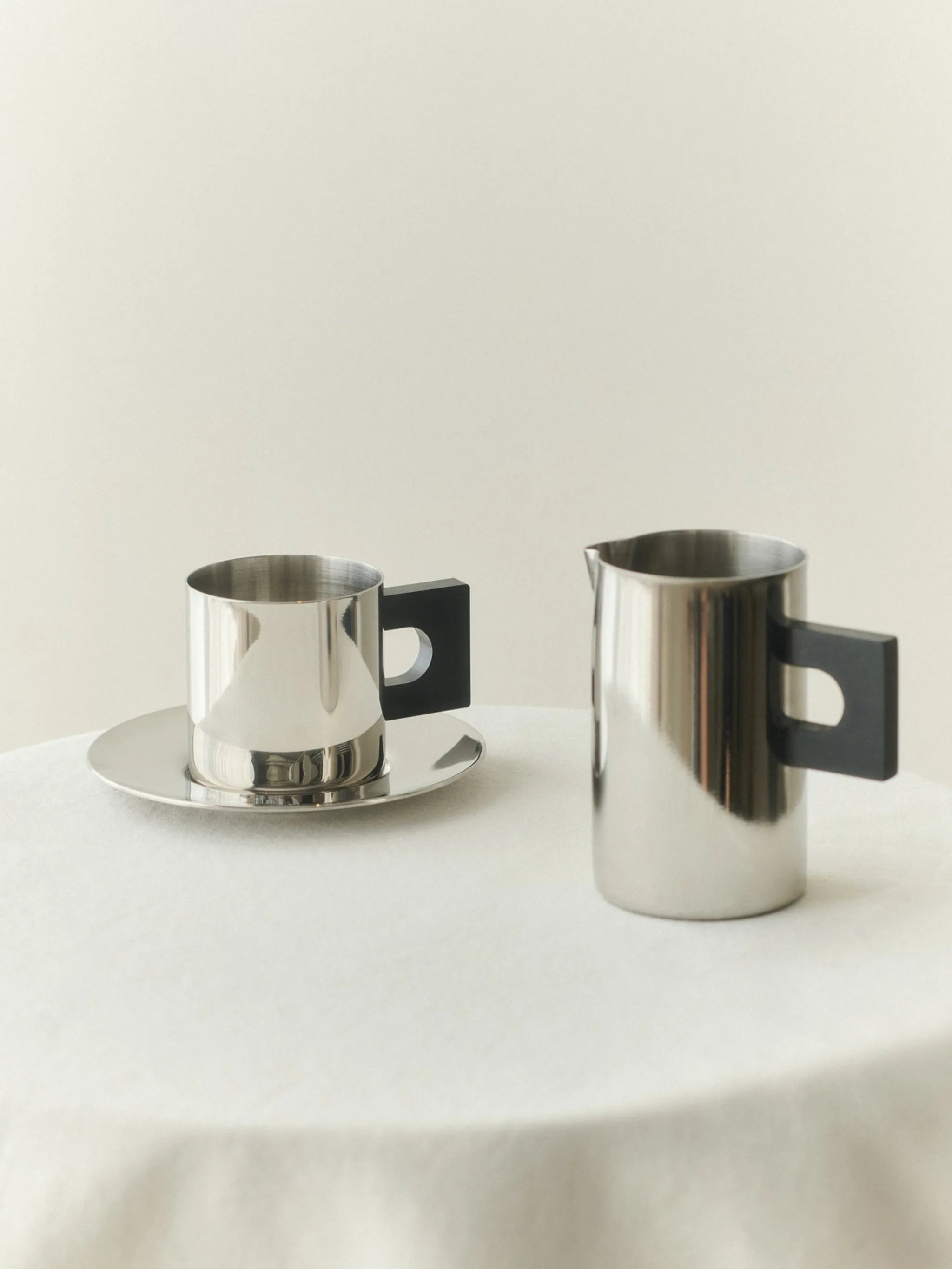 S.R polished-finish geometric-handle pitcher